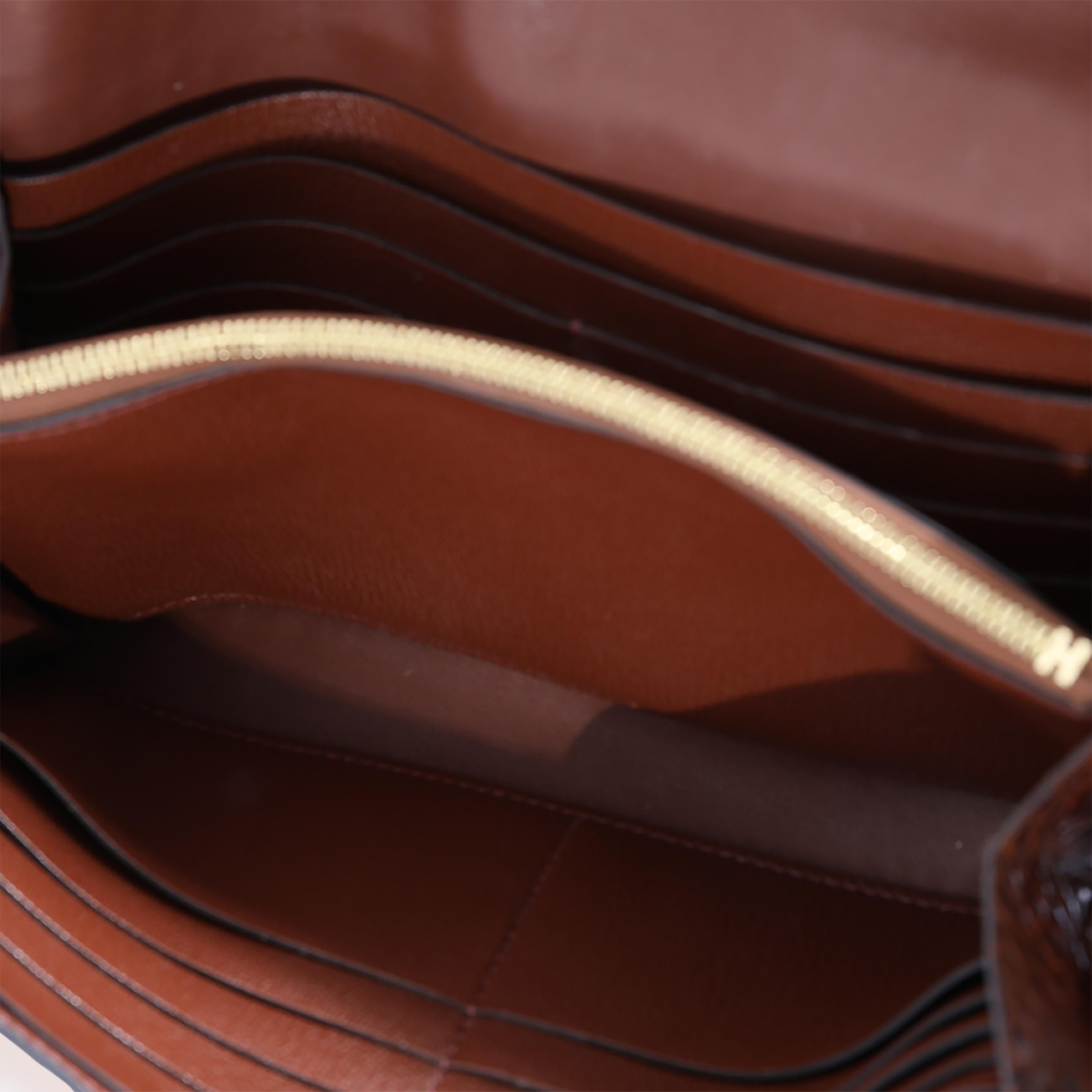 Listing Title: Hermès Miel Shiny Alligator Constance Wallet GHW
SKU: 122911
MSRP: 15300.00
Condition: Pre-owned 
Handbag Condition: Very Good
Condition Comments: Very Good Condition. Patina at leather. Scuffing and marks throughout exterior. Heavy