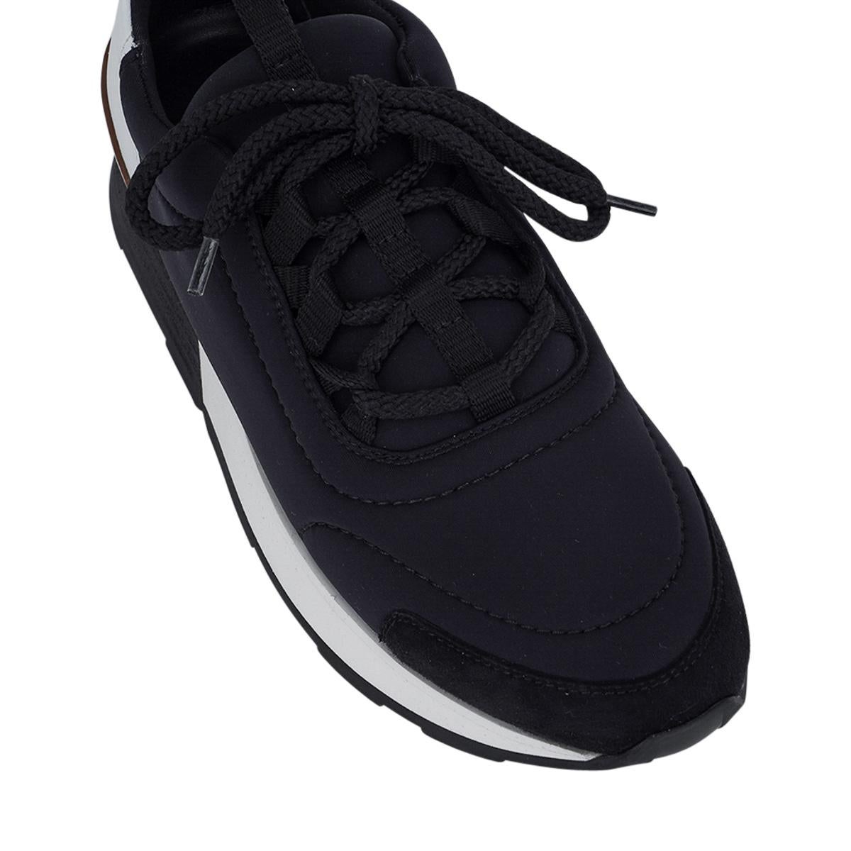 Mightychic offers a pair of Hermes Miles Sneakers featured in Black and White. 
Accentuated with Brown rear detail.
Technical canvas with goatskin suede toe and rear White calfskin.
Almond toe and lightweight for great comfort.
Comes with sleeper
