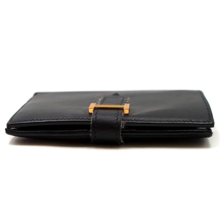 Hermes Mini Bearn H Mens Wallet

- Mini Bearn H Mens Wallet
- Smooth black leather
- Gold-tone hardware
- A folded slip compartment for notes
- A zipped coin pocket
- 4 card slots
- 4 larger slip pockets that could be used for both cards and