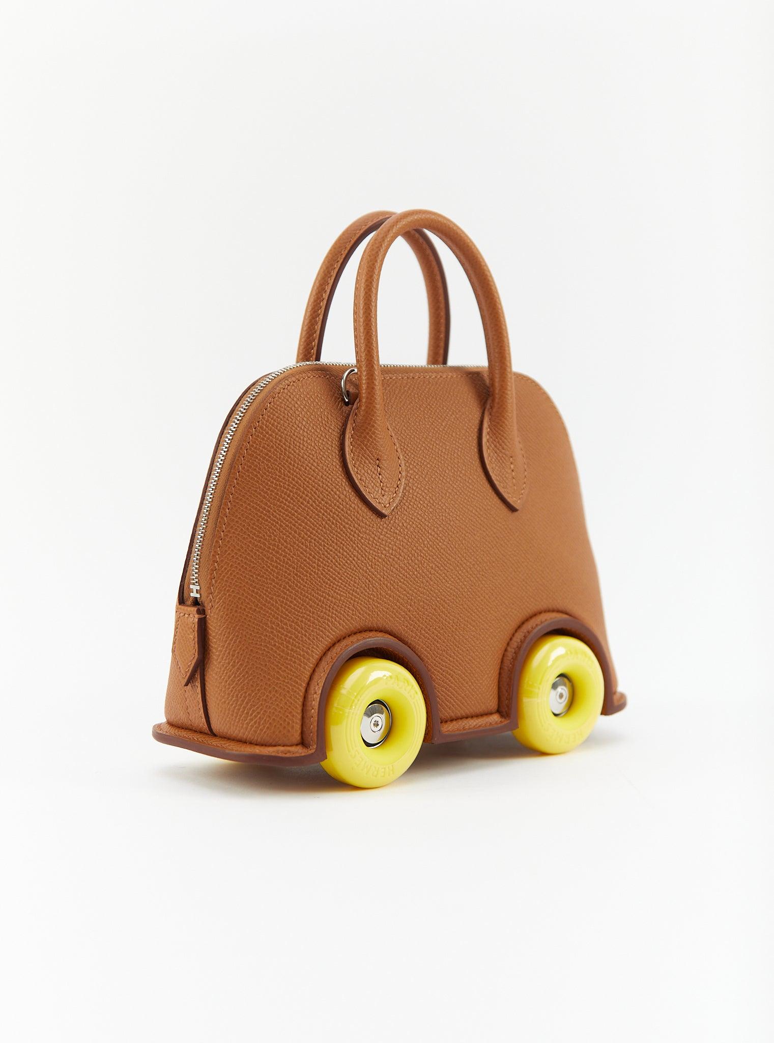 Hermès Mini Bolide on Wheels in Gold

Epsom Leather with Palladium Hardware 

B Stamp / 2023

Accompanied with: Original receipt, Hermès Box, dustbag and ribbon

Measurements: H 14.5 x W 18.5 x D 7.3 cm

Strap length: 104 cm 