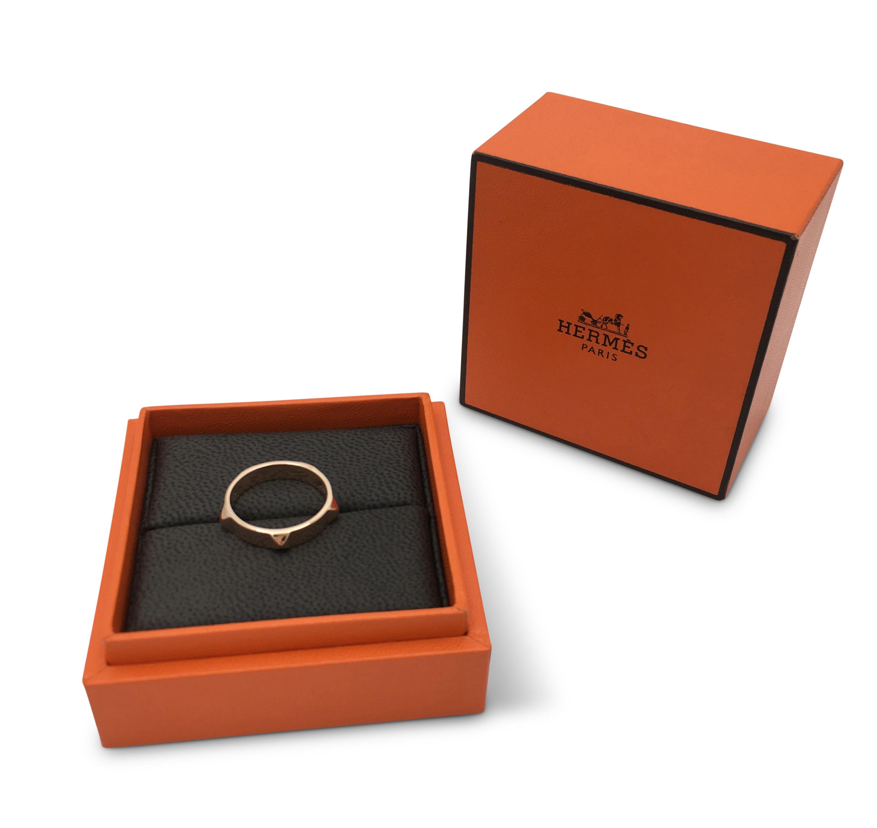 Authentic Hermes 'Mini Clous' ring crafted in 18 karat rose gold features domed four sided studs all around. Signed Hermes, 750, Made in Italy, with serial number and hallmarks. Ring size 54 (US 7). Presented with original box, no papers. CIRCA