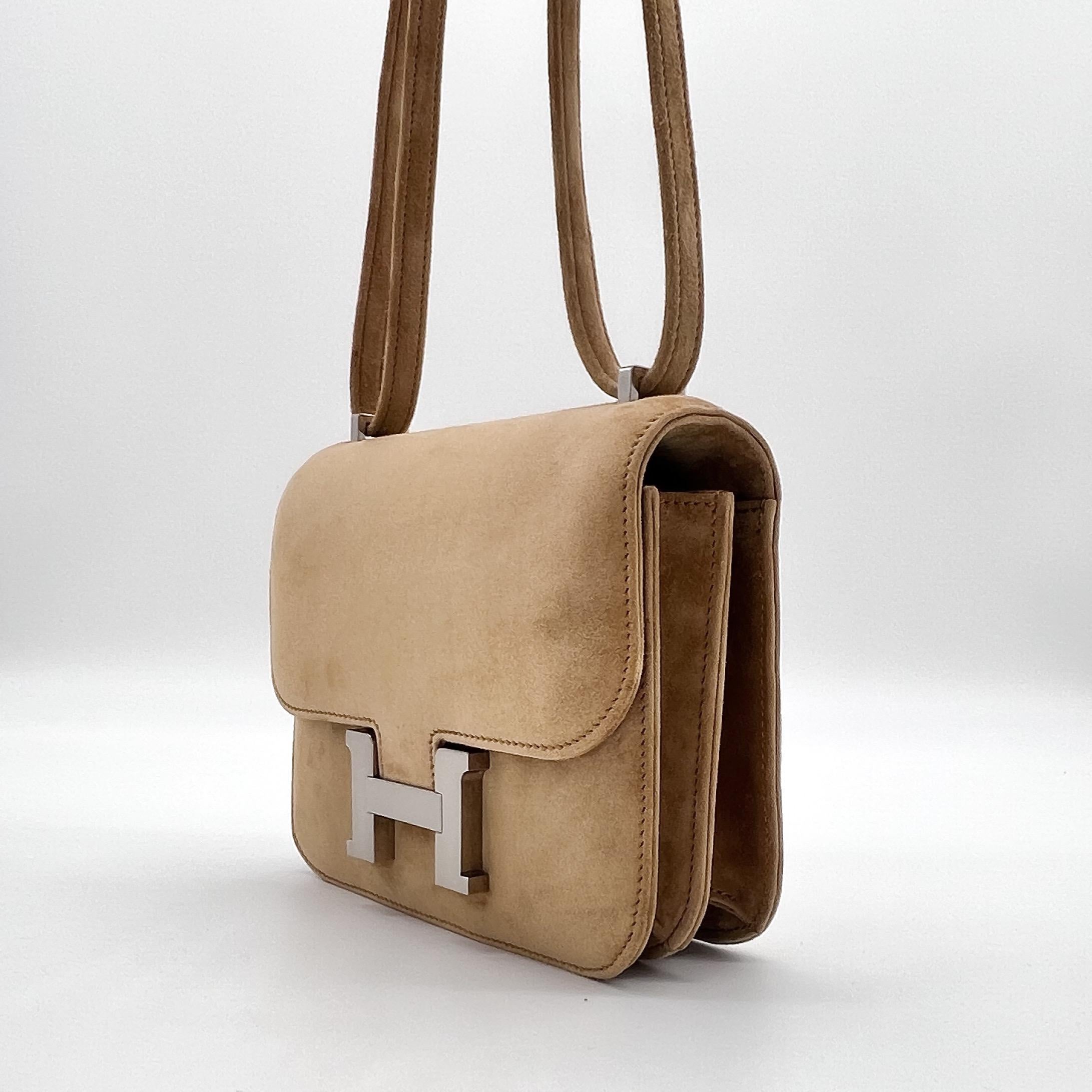 A beautiful Limited Edition Hermès Mini Constance Veau Doblis. This Mini Constance is crafted in Ocre Suede a new colour for 2022. The bag is suede throughout including the interior. The bag stamp is Z and was originally purchased in July 2022. The