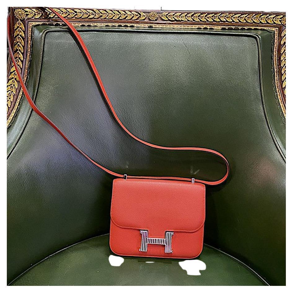 HERMES Mini Constance in Orange Mysore goat Leather. Silver plate Hardware. The H buckle is enamel.
In very good exterior condition, pen mark under the flap.
Made in France.
Size: 18 x 16 x 3cm.
Shoulder strap: single 106 cm, double 60 cm
Serial