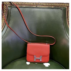 HERMÈS Mini Constance en cuir de chèvre Mysore orange