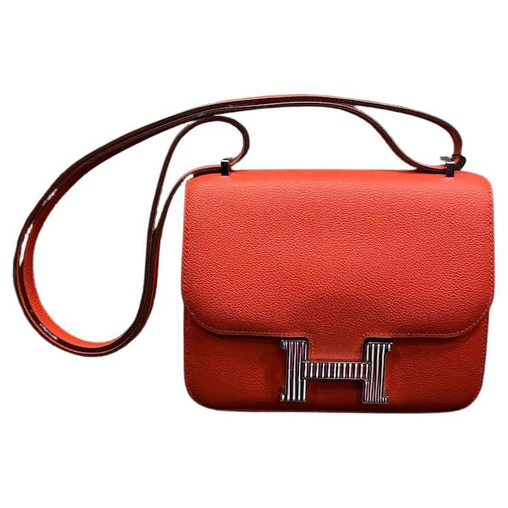 HERMES Mini Constance aus orangefarbenem Mysore- Ziegenleder