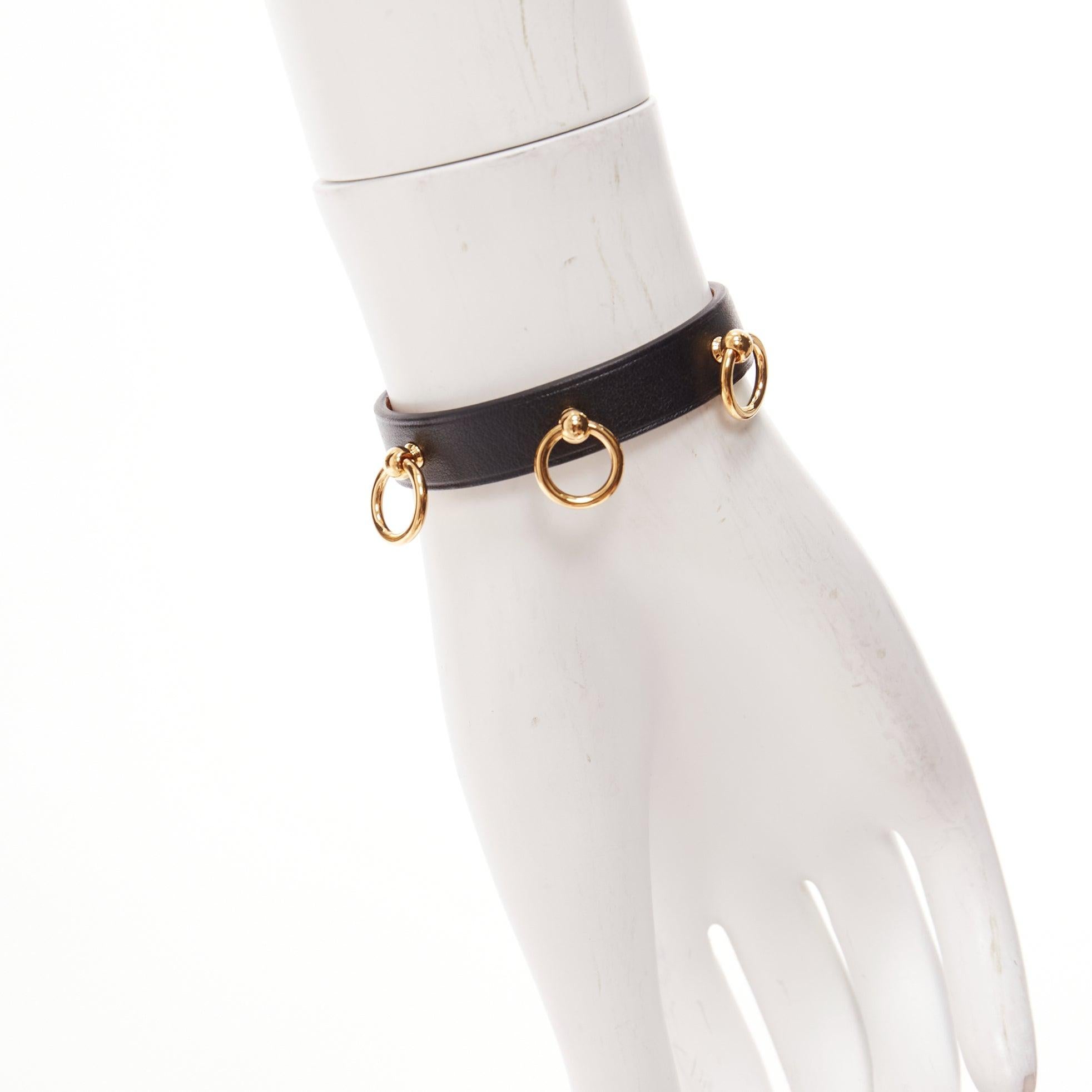 HERMES Mini Dog Anneaux gold ring black smooth leather lockette bracelet
Reference: AAWC/A01009
Brand: Hermes
Model: Mini Dog Anneaux
Material: Leather, Metal
Color: Black, Gold
Pattern: Solid
Closure: Belt
Lining: Nude Leather
Extra Details: Gold 3