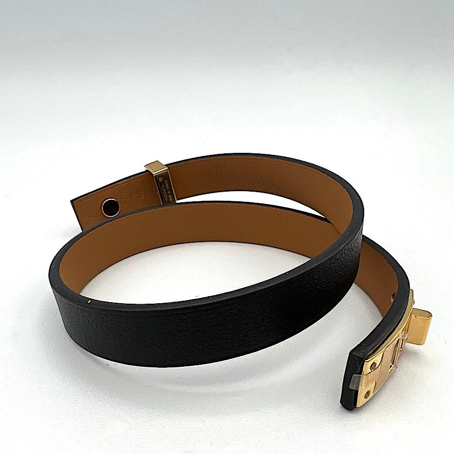 HERMES Mini Dog double tour Bracelet in Black Leather and Gilt Metal. Size: 2
Never worn
Made in France.
Signed: yes
Dimensions: total length: 35 cm
Stamp: X, year: 2016.

Will be delivered in a non-original dustbag