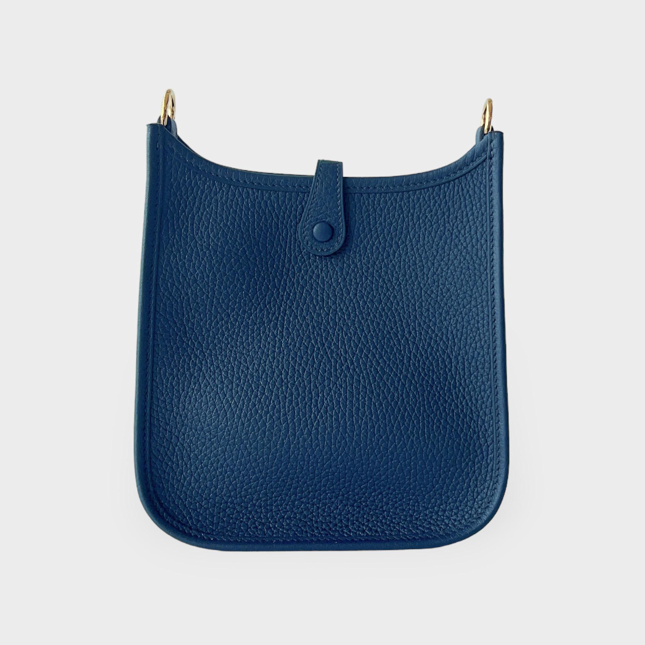 The Hermes Mini Evelyne 16 in Bleu De Prusse is a casual design that can be used for your everyday routine. This is the smallest size Hermes Evelyne bag and is made from handcrafted Bleu De Prusse Clemence leather, making it harder to scratch or
