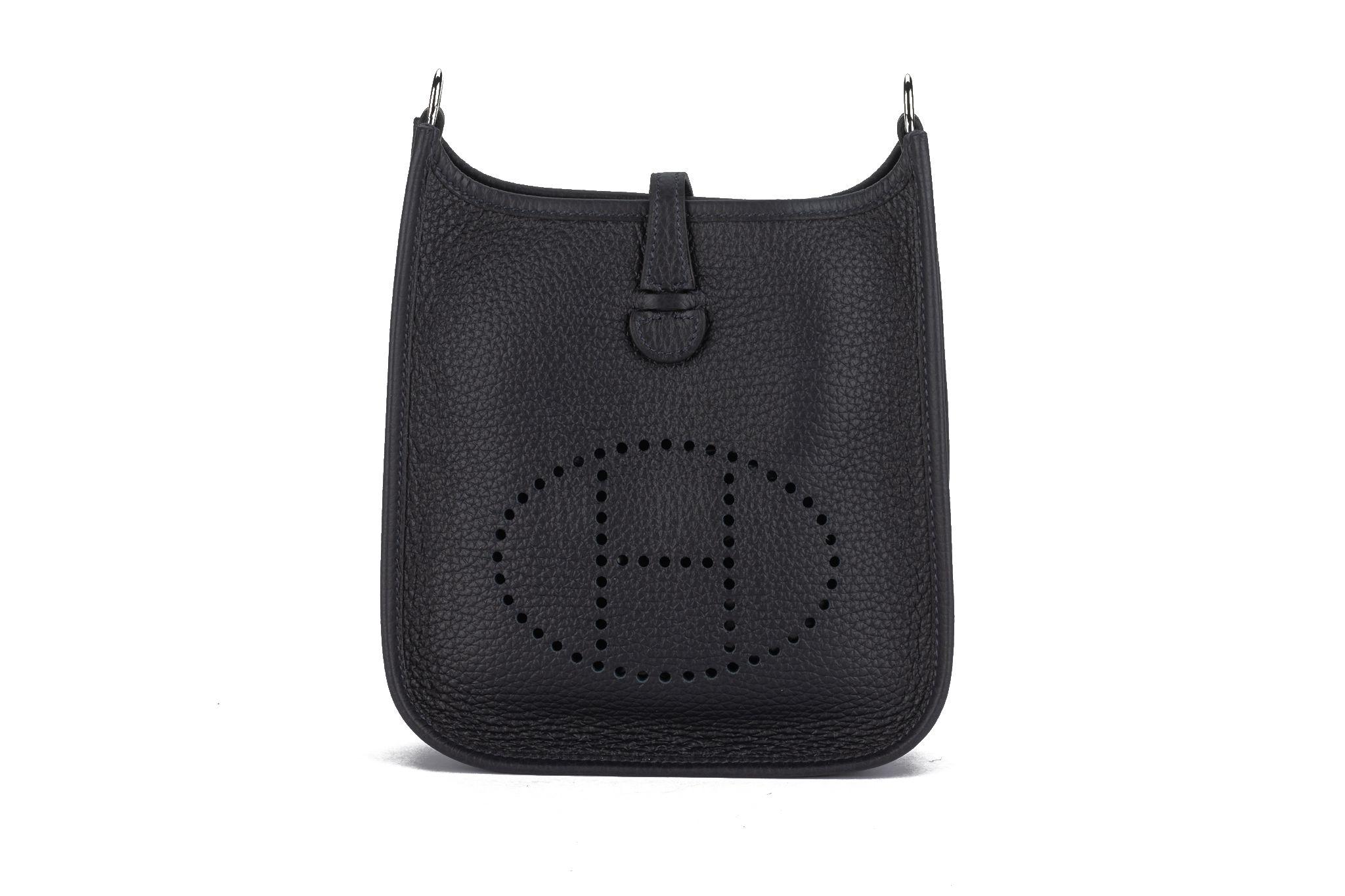 Hermès Mini Evelyne Bag in indigo blue taurillon clemence leather with palladium hardware and a wool bicolor shoulder strap. Shoulder drop, 22