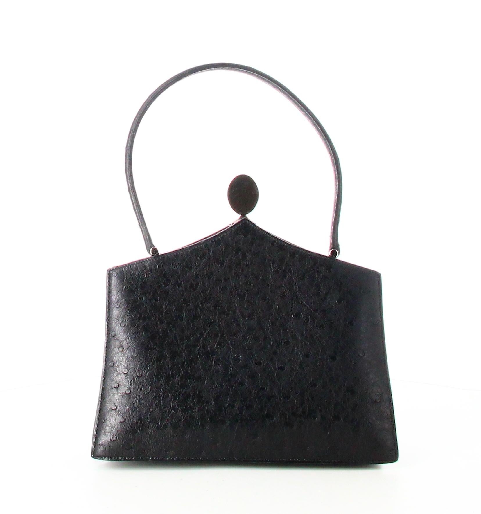 Hermès Mini Handbag Black Leather 

- Very good condition. Shows very slight signs of wear over time.
- Hermes Handbag 
- Black leather 
- Black leather hanse 
- Clasp: silver magnet 
- Interior: blue leather plus three inside pockets