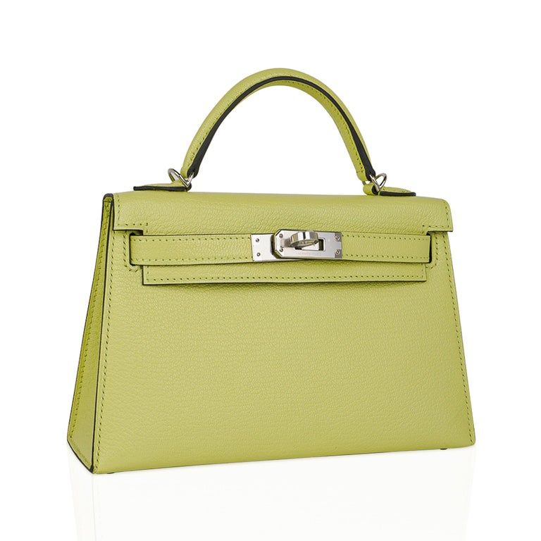 Mightychic offers an Hermes Kelly 20 Mini Sellier bag featured in Jaune Bourgeon.  
Gorgeous muted lime.
Chevre leather accentuated with Gold hardware.
Comes with signature Hermes box, shoulder strap, and sleeper.
Please see our Kelly 20 Collection