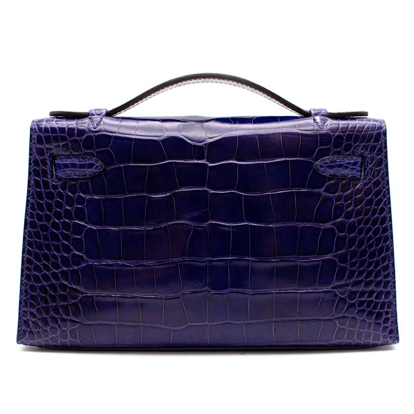 Hermès Kelly Pochette 22 in Blue Electric Lisse Alligator Mississippiensis with Palladium Hardware. 
2014

Includes Dust Bag. 
Size: Mini Pochette

Please note. This bag does not have its CITES

22 w x 13 h x 6 d cm

