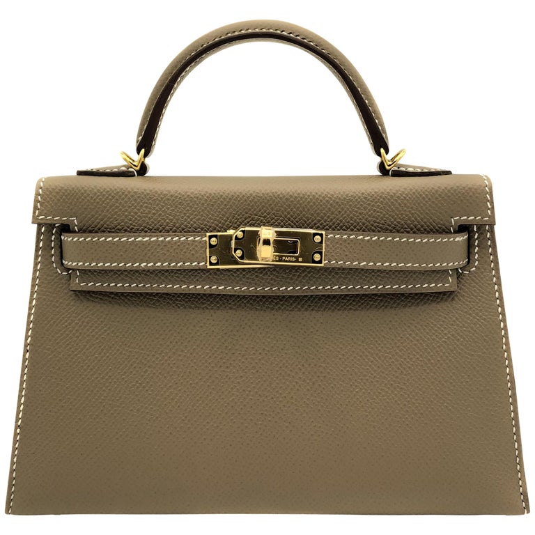 Hermès Ring Lizard Kelly Pochette with Gold Hardware. Condition: 2