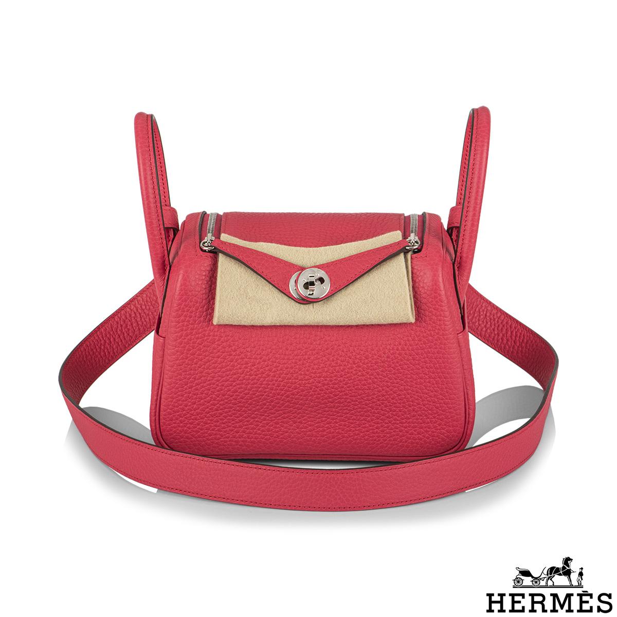 An exquisite And Chic Hermès Mini Lindy. The exterior of this mini Lindy is crafted with rose extreme clemence leather with palladium hardware. It features tonal stitching, double zipper pulls, front Hermès twist lock, single pocket on each side,