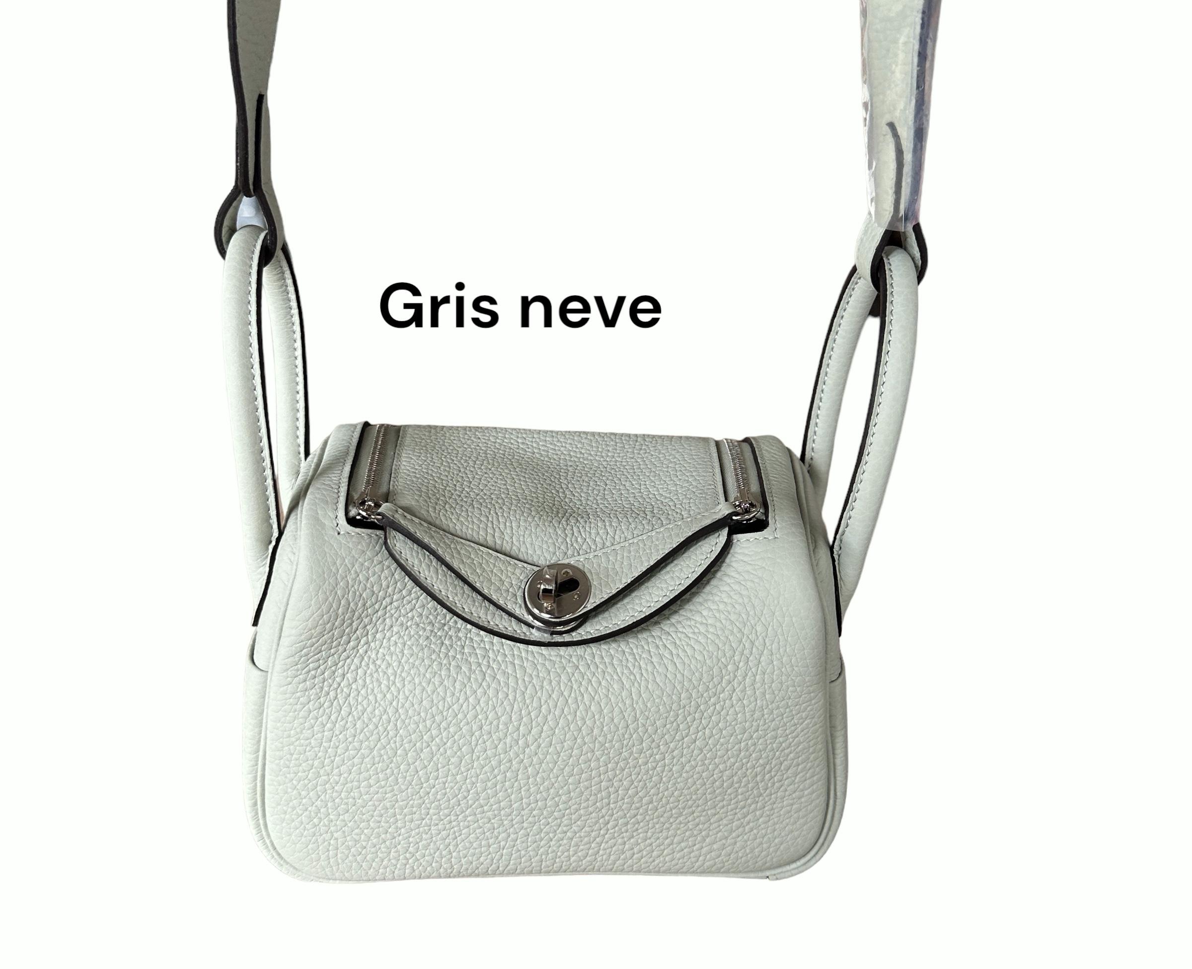 Hermes Lindy Bag
The New Size
The Mini
Crossbody
Color: Gris Neve
Palladium-plated Hardware
The Hermes Mini Lindy is a smaller version of the classic Lindy bag, which is a popular style of handbag from the brand. The Mini Lindy has the same features