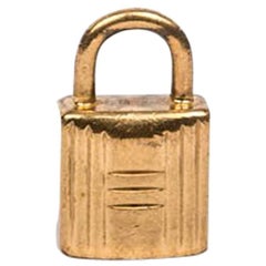 HERMES Mini Padlock Pendant in Gilded Metal