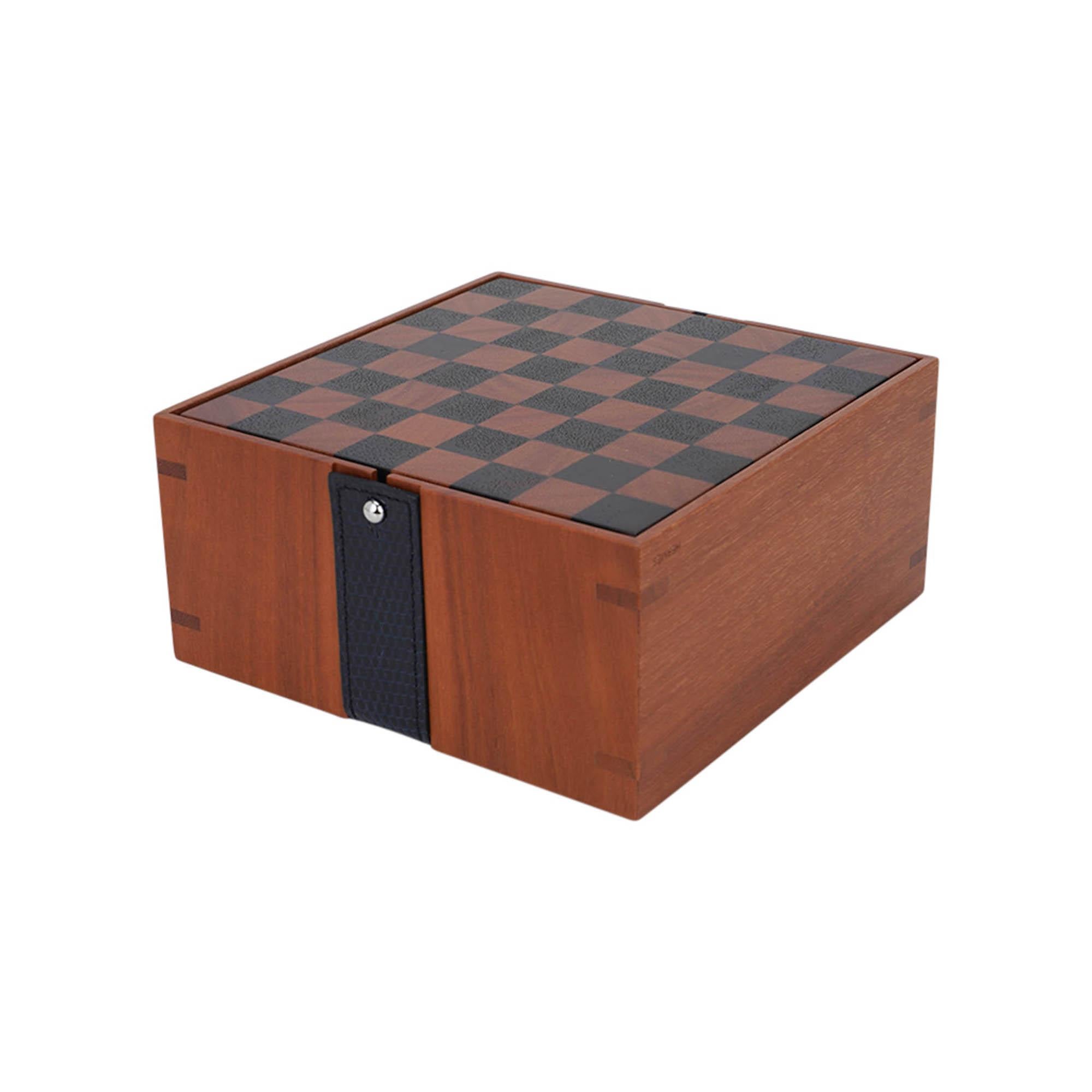 Mightychic offers an Hermes Mini Samarcande Chess Set  with a dash of luxury!
Featured in sapodilla wood and solid cassia wood.
A mini Chess game with magnetic pieces.
Continuing the Equestrian motif, the box comes with a  removeable Bleu Indigo
