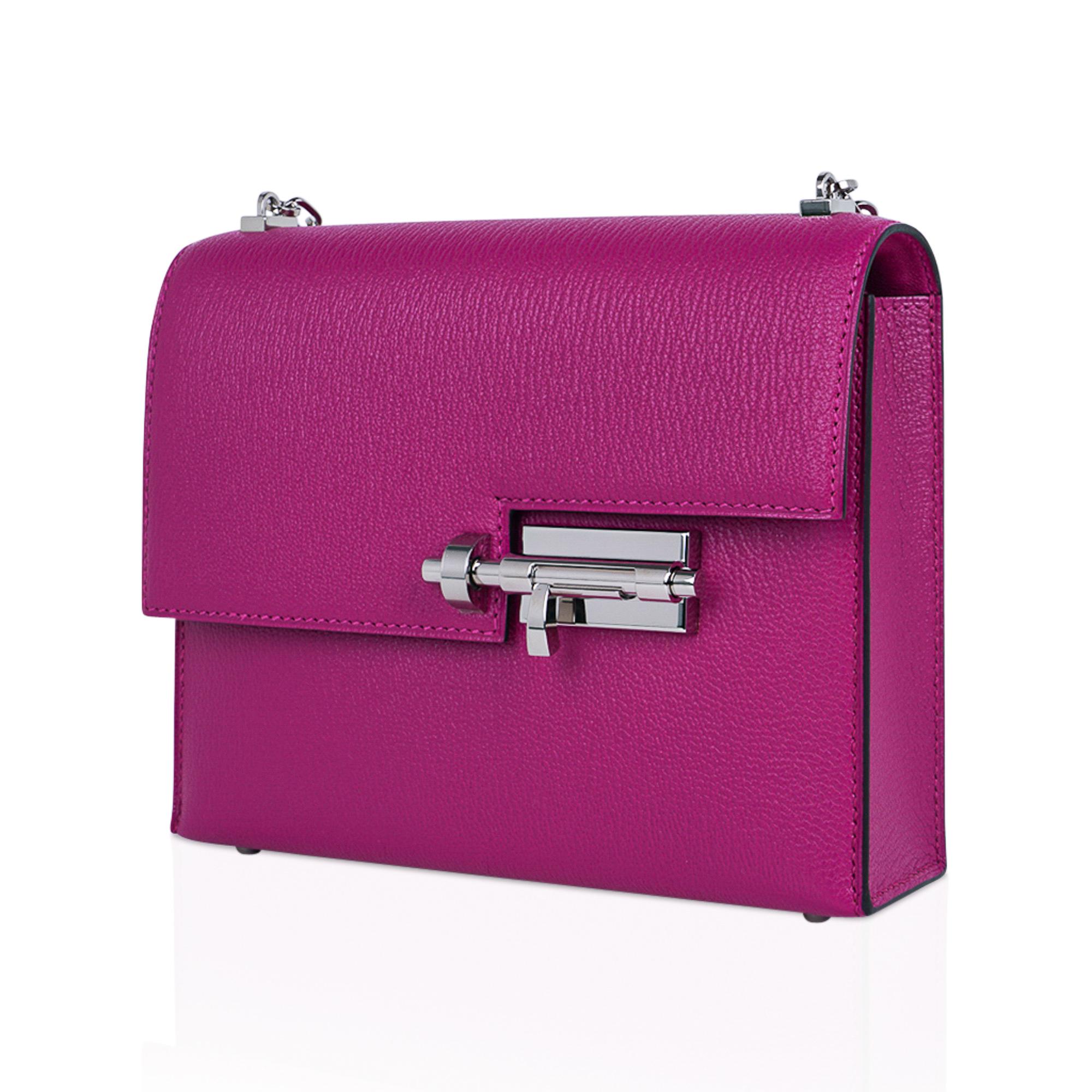 Mightychic offers an Hermes Mini Verrou Chaine bag featured in saturated rich Rose Pourpre.
Palladium link strap with the stylized deadbolt closure.
Leather interior with two patch pockets.
Coveted Chevre leather.
Signature stamp under the