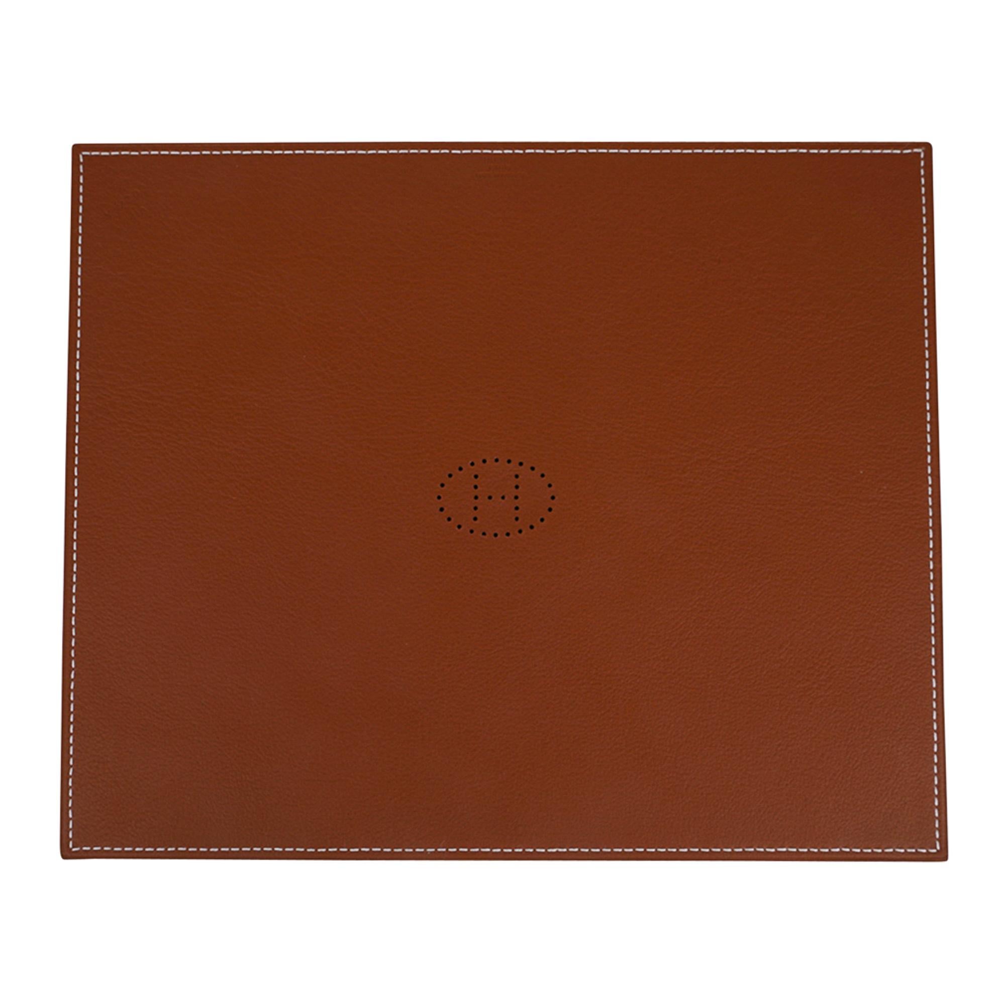 Mightychic offers an Hermes Mises et Relances H Evelyne Mouse Pad.
Reversible with perforated Evelyne H design.
Beautifully crafted from smooth H taurillon leather, this rectangular pad features Bleu and Fauve with bone topstitch.
The inspiration