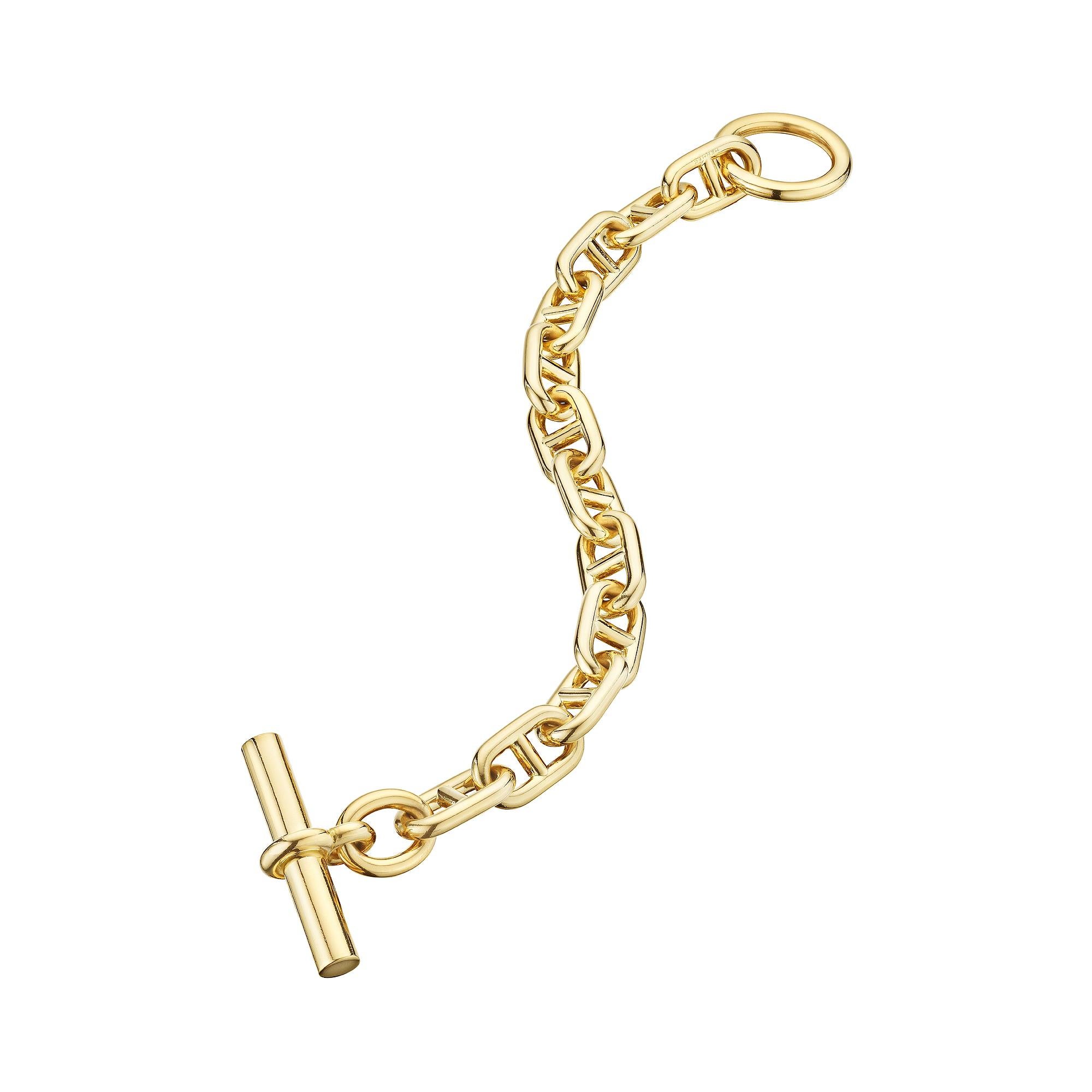 Bold and uncompromising this Hermes Paris modernist 'chaine d'ancre' toggle large link bracelet is the statement piece you have been searching for.  With 12 links weighing 110 grams, this polished 18 karat yellow gold bracelet is extraordinarily