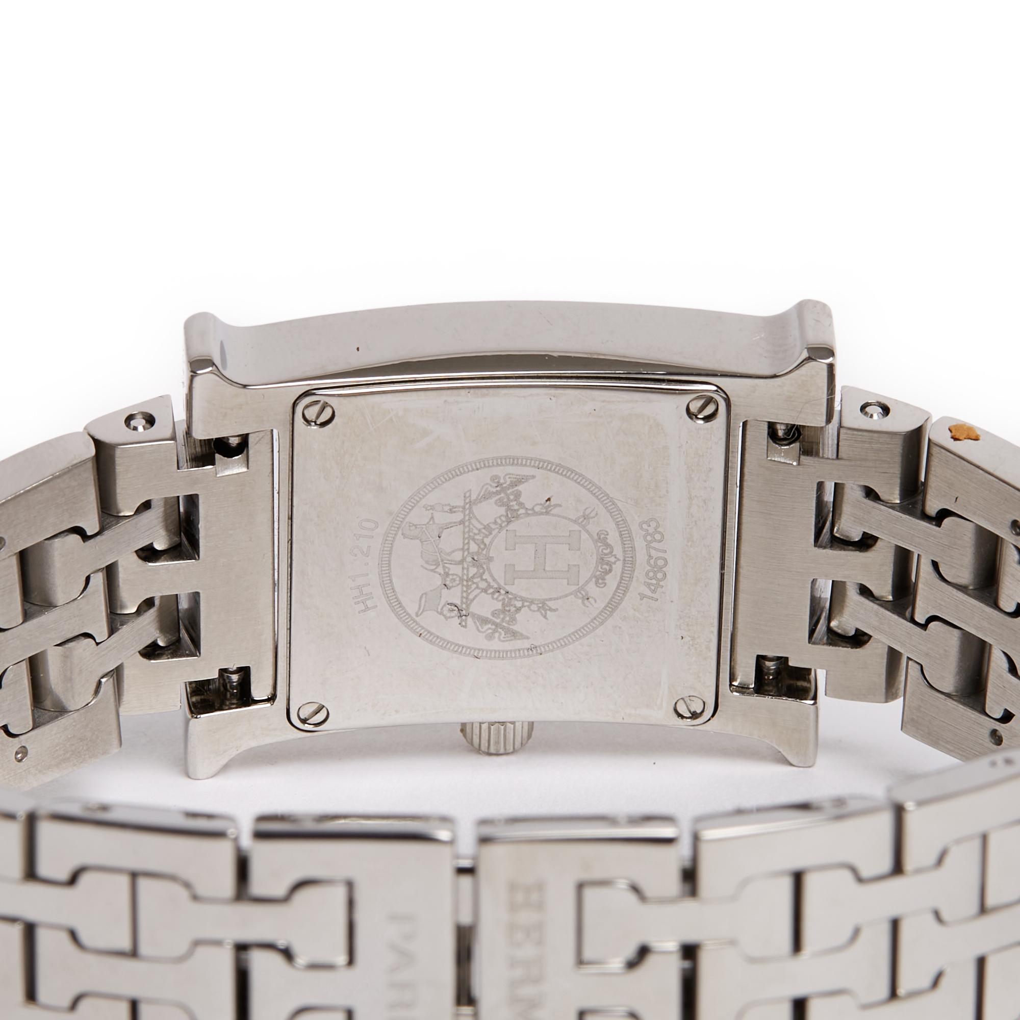 Hermès watch model Heure H format Small Model, quartz movement, white dial with Arabic numerals, steel case, H articulated steel bracelet with double folding clasp. Case diameter 2.5 cm, bracelet width 1.5 cm, total length of the closed watch 17.2