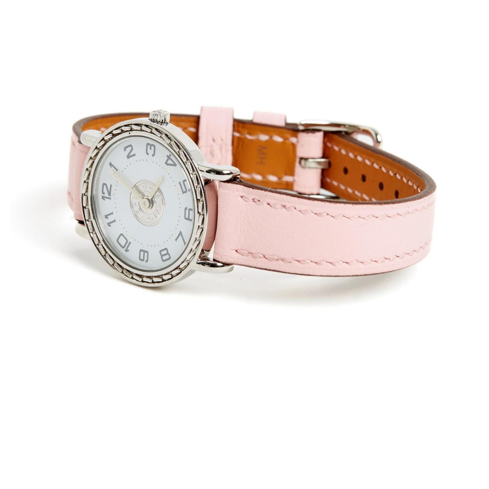 Hermès Sellier model watch, PM format, in steel, quartz movement, white dial with Arabic numerals, pale pink leather strap (