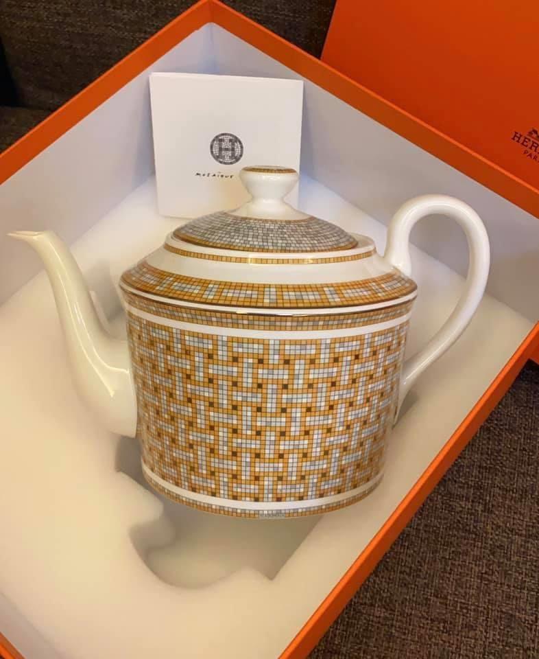 Hermes Mosaique Au 24 Gold Teapot 

Hermes Mosaique au 24 is inspired by Henry Pannier’s 1926 design of its flagship store. This collection reflects the store’s original color scheme of ochre and grey, as well as the signature Greek-style frieze