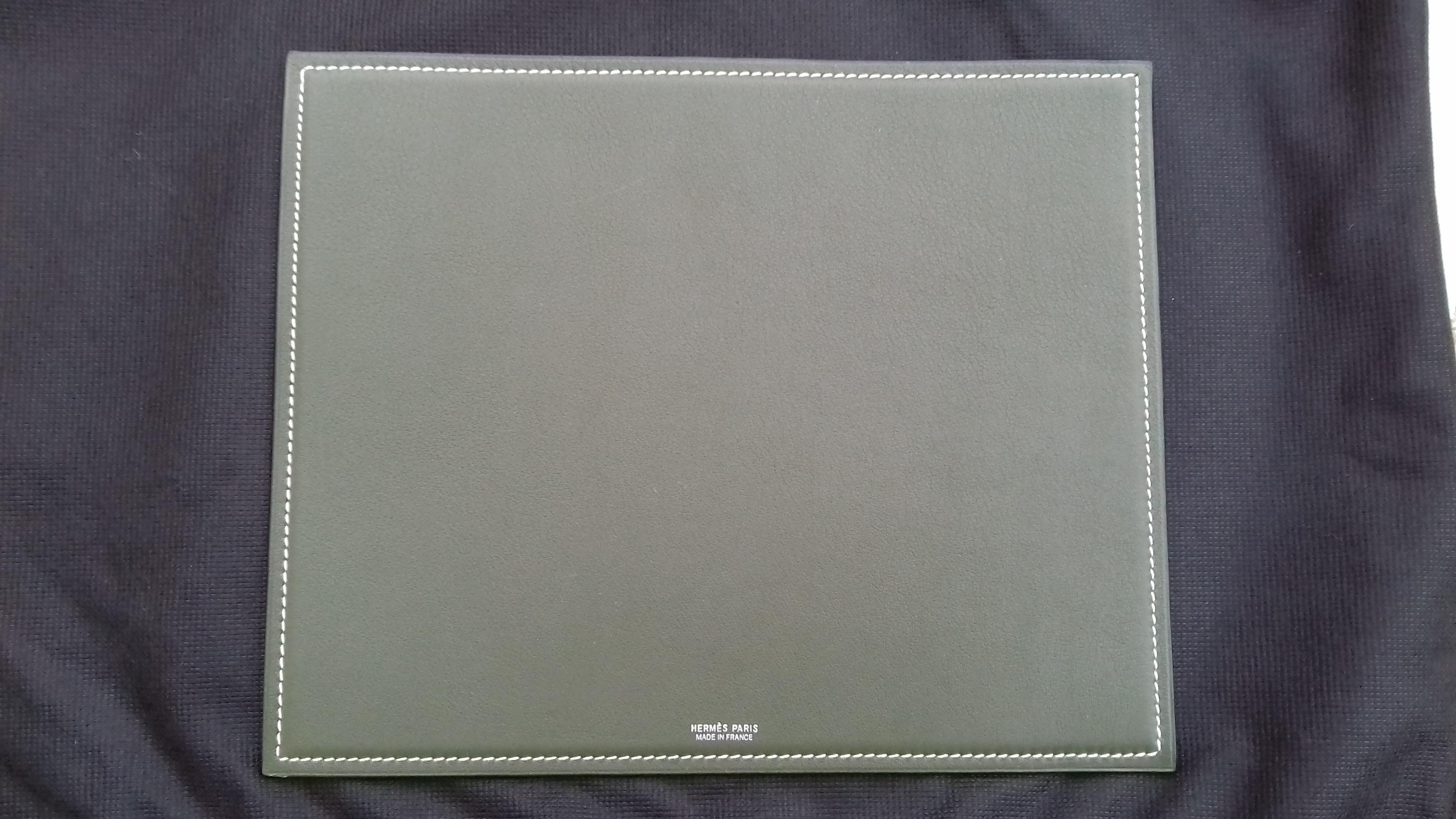 Rare Authentic Hermès Mousepad

Can be used as small desk blotter (pay attention to dimensions)

Made in France

Stamp E in square (2001)

Made of Leather

Colorways: One side Green-Grey, other side Apple Green

White seams


