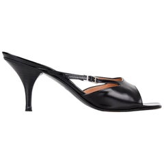 Hermès Mule Vinatge en cuir noir avec boucle en H et accessoires en palladium, Taille 37,5/7,5