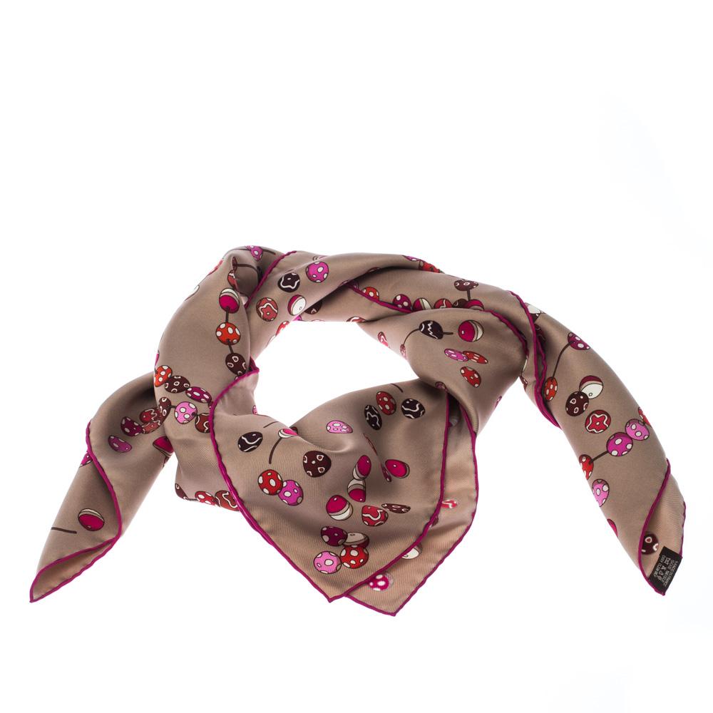You are bound to impress onlookers with this scarf from Hermes. Luxuriously cut from silk in France, the scarf has a multicolored print of dancing pearls all over, and every accent on the piece speaks high-fashion. The scarf is complete with the