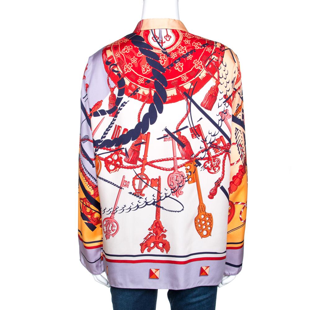 A prized buy for lovers of Hermes creations and designs. This blouse, covered in Les Clefs prints featuring multiple keys comes in lovely multicolored hues. This luxurious creation is crafted from pure silk and will change the way you dress for