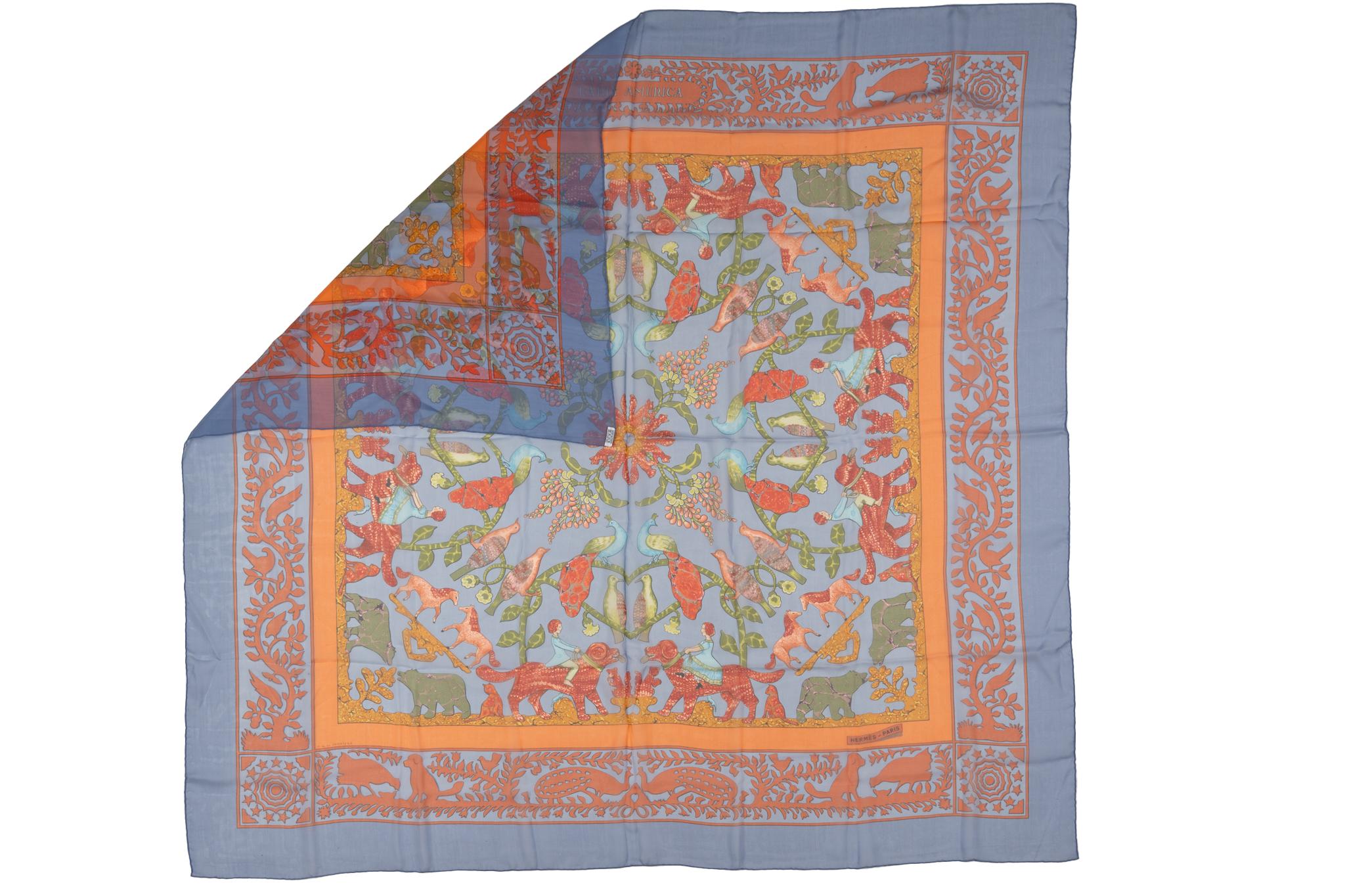 Hermès silk chiffon multicolor flower shawl with light blue trim. Excellent condition, hand rolled edges.
No box.
