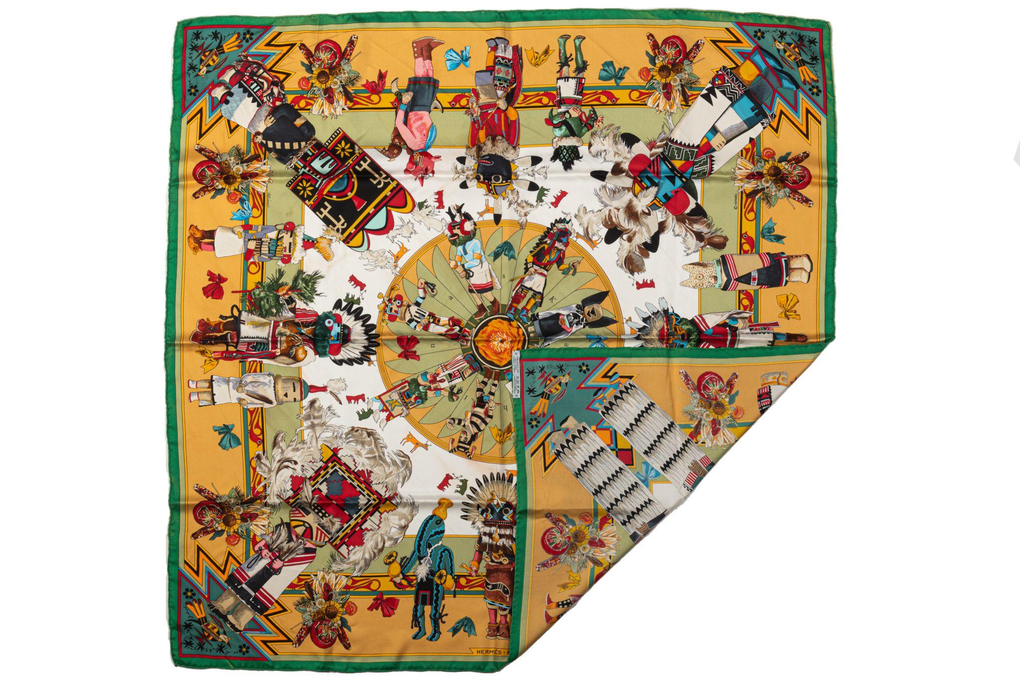 Hermès 100% silk twill Kachinas scarf by designer Kermit Oliver. Mustard and green color combination. Excellent condition. Dry clean only.

