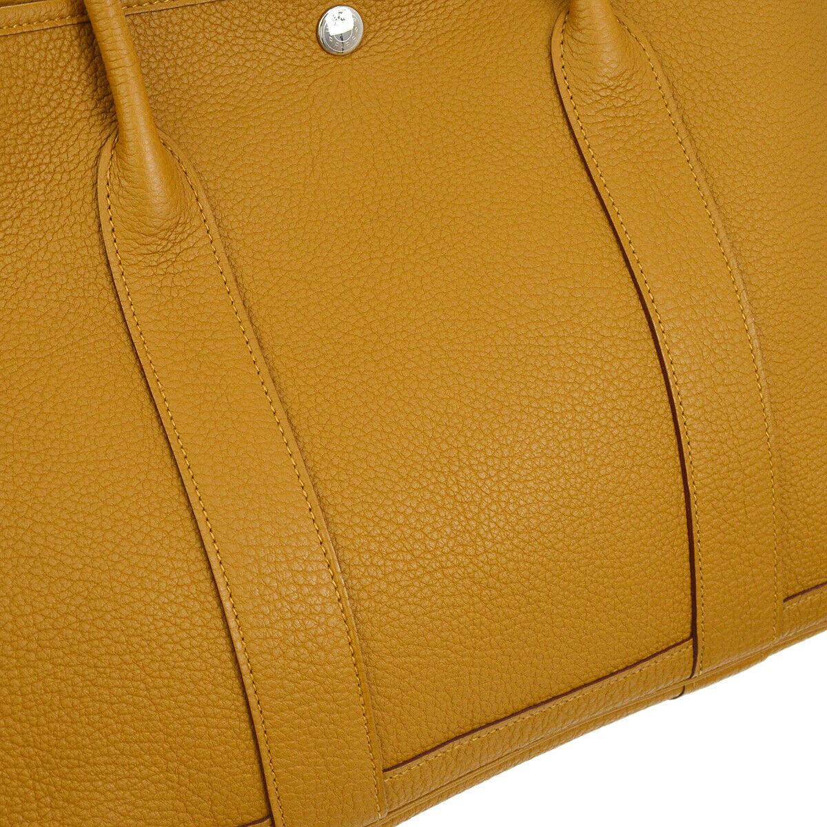 Hermes Mustard Leather Large Carryall Travel Garden Top Handle Satchel Tote Bag

Leather
Palladium hardware
Snap button closure
Leather and woven lining
Made in France
Handle drop 6