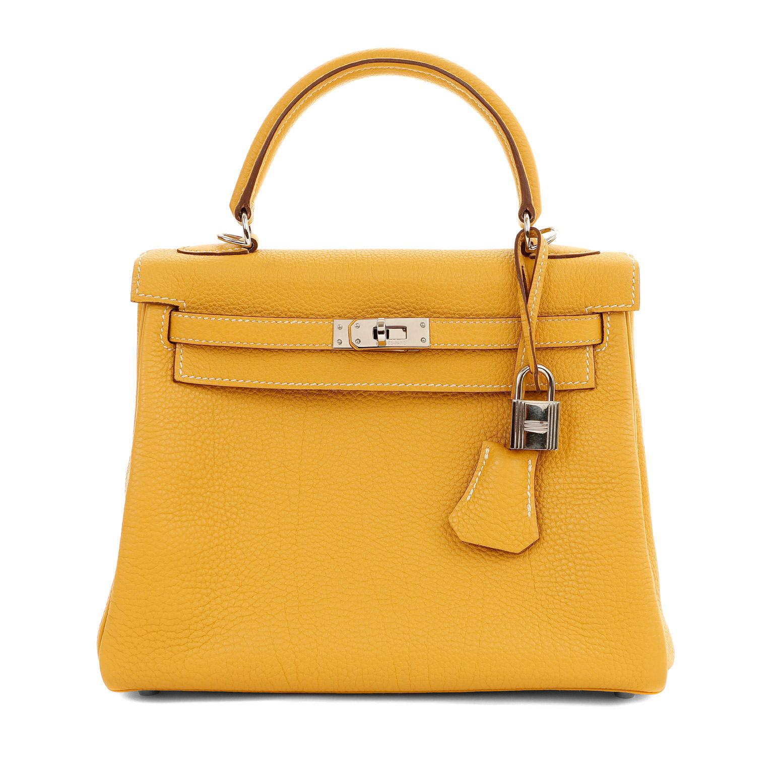 This authentic Hermès Mustard Yellow 25 cm Kelly is in pristine condition.  Hermès bags are considered the ultimate luxury item worldwide.  Each piece is handcrafted with waitlists that can exceed a year or more.  The ladylike Kelly is classic and