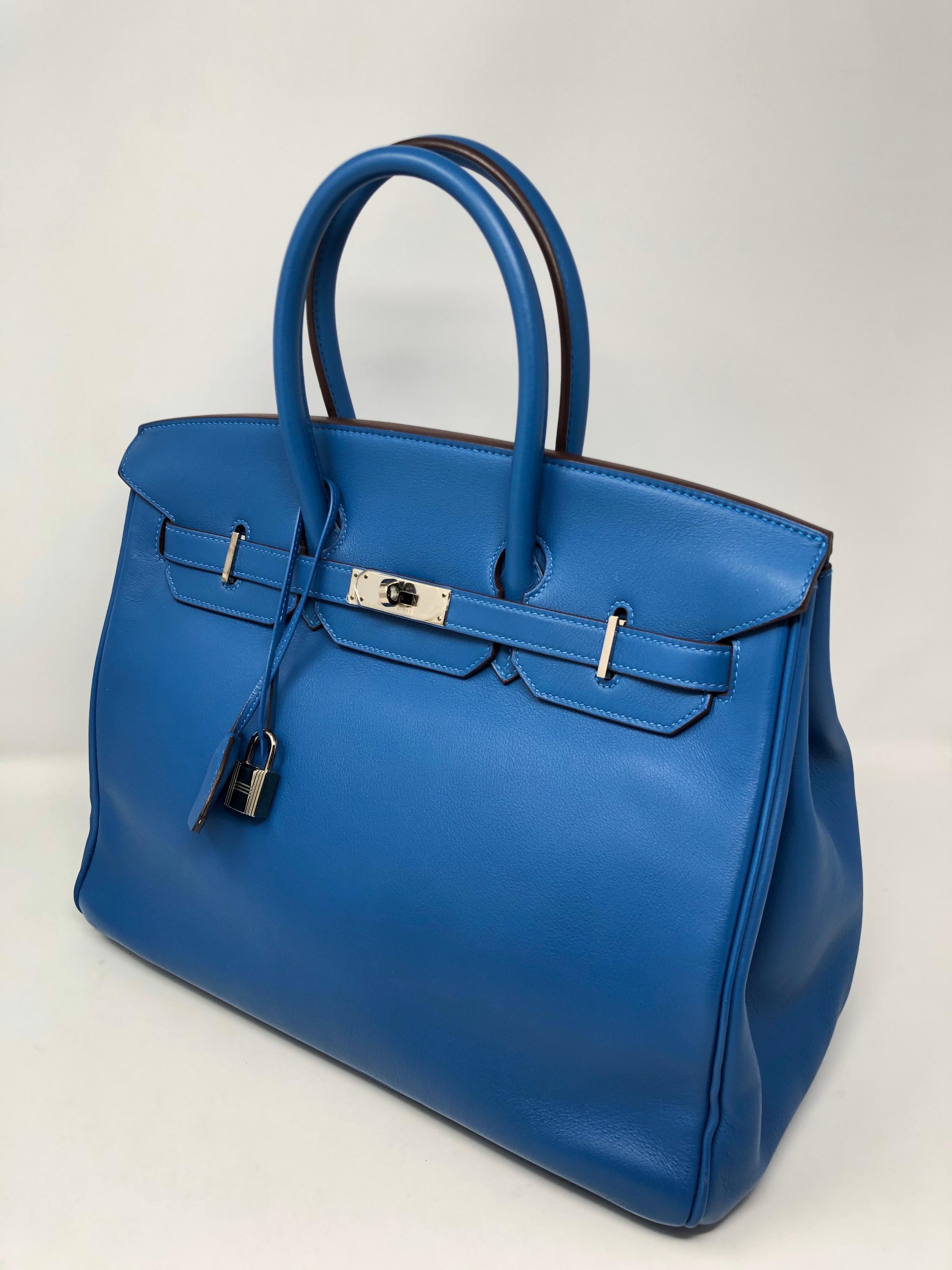 Hermes Birkin 35 Mykonos Blue Bag. Palladium hardware. Swift leather. Excellent condition. Beautiful blue color. Includes full set. Clochette, lock, keys, dust cover and box. Guaranteed authentic. 