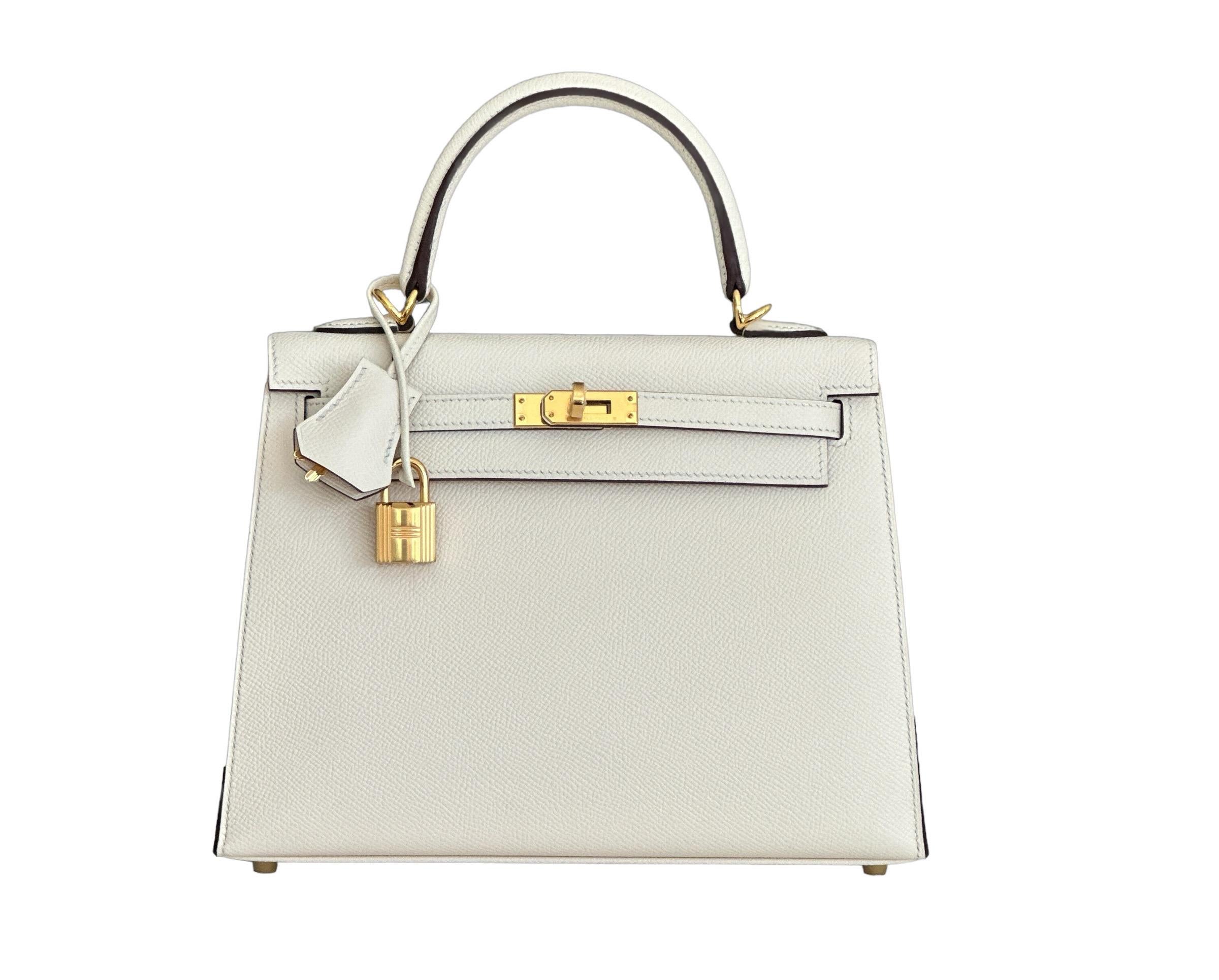 Hermes Kelly 25cm Sellier Style, Rigid
Nata Epsom with Gold Hardware, brand new
Collectors Dream
Almost Impossible to Find
We have it!
We took photos in different lights , Nata is a creamy off white color

The Hermes Kelly Bag is a luxurious handbag