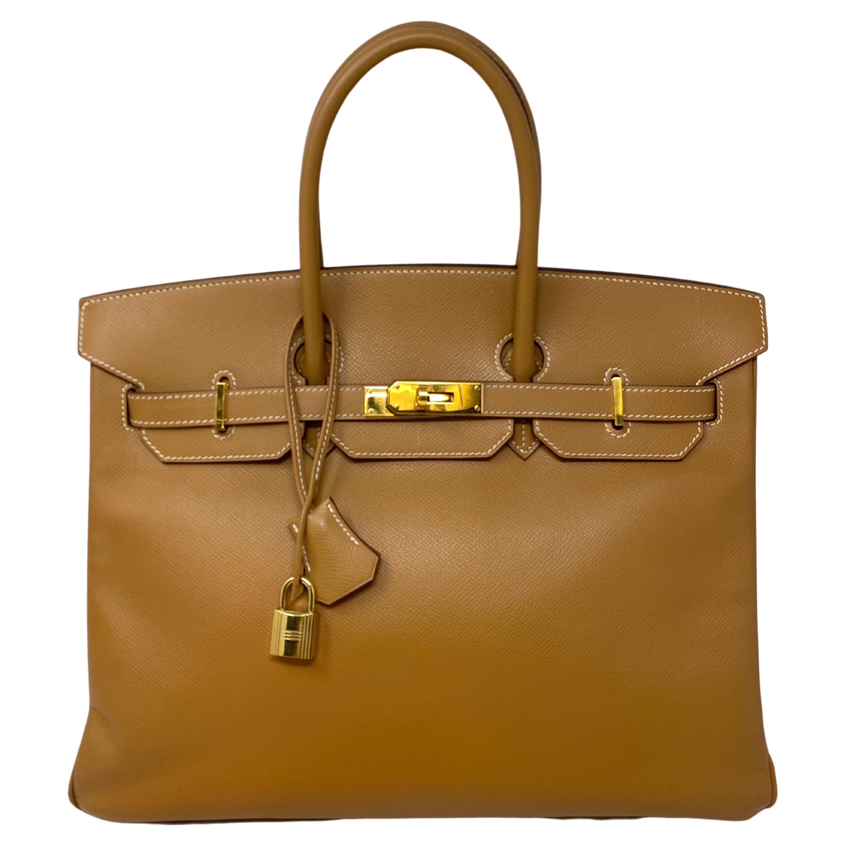 Hermes Natural Tan Birkin 35 Bag. Gold hardware. Light tan color close to gold. Excellent condition. Vintage Courchevel leather. Beautiful Birkin 35 Bag. Great neutral color. Includes clochette, lock, keys, and dust bag. Classic Birkin Bag to invest