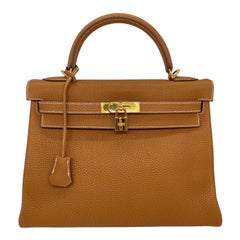 Hermès Natural Clemence Retourne Kelly Handbag with Gold Hardware 32cm, 2007.