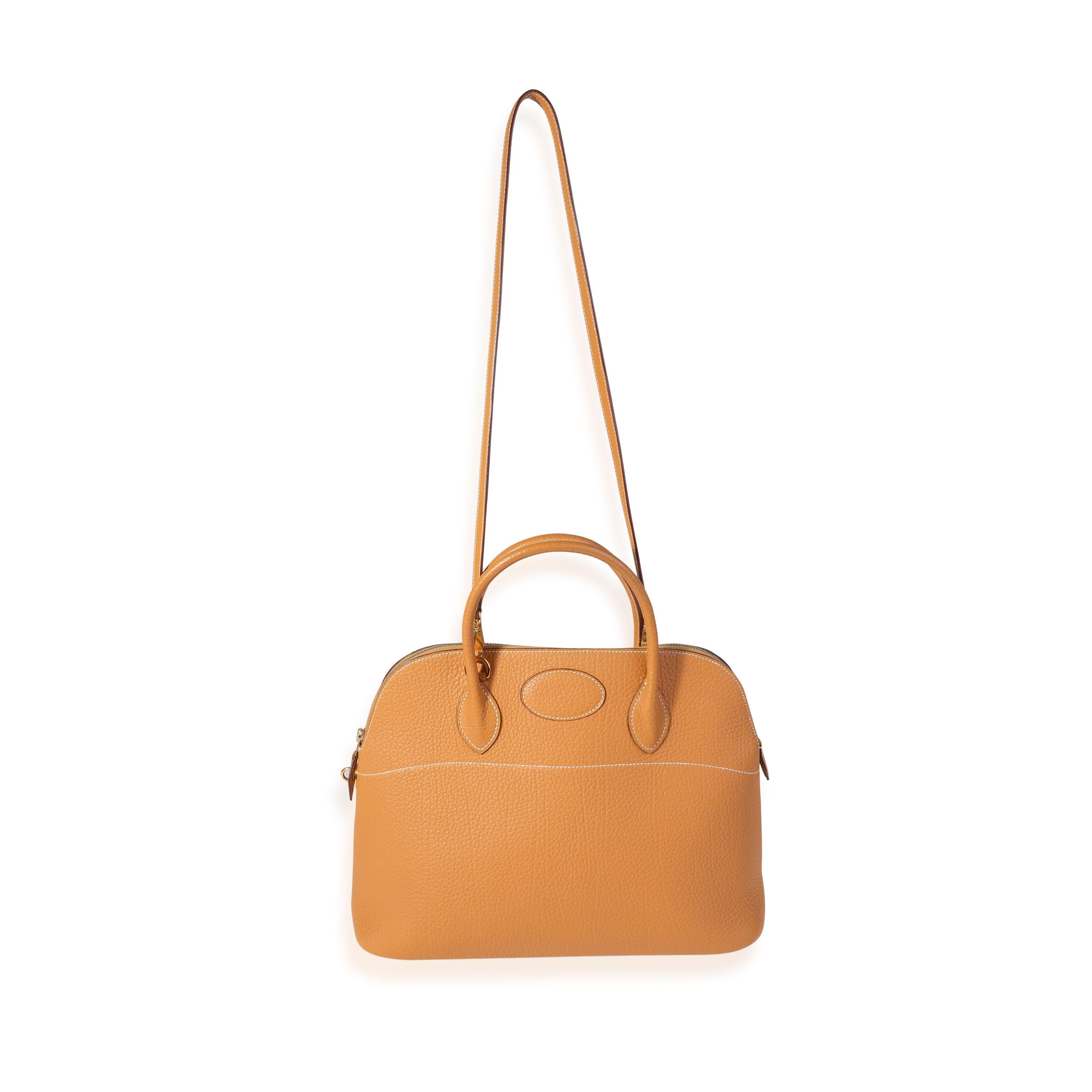 Listing Title: Hermès Natural Fjord Bolide 35 GHW
SKU: 121264
Condition: Pre-owned 
Handbag Condition: Very Good
Condition Comments: Very Good Condition. Scuffing to corners. Light discoloration to leather. Scratching and light tarnishing to