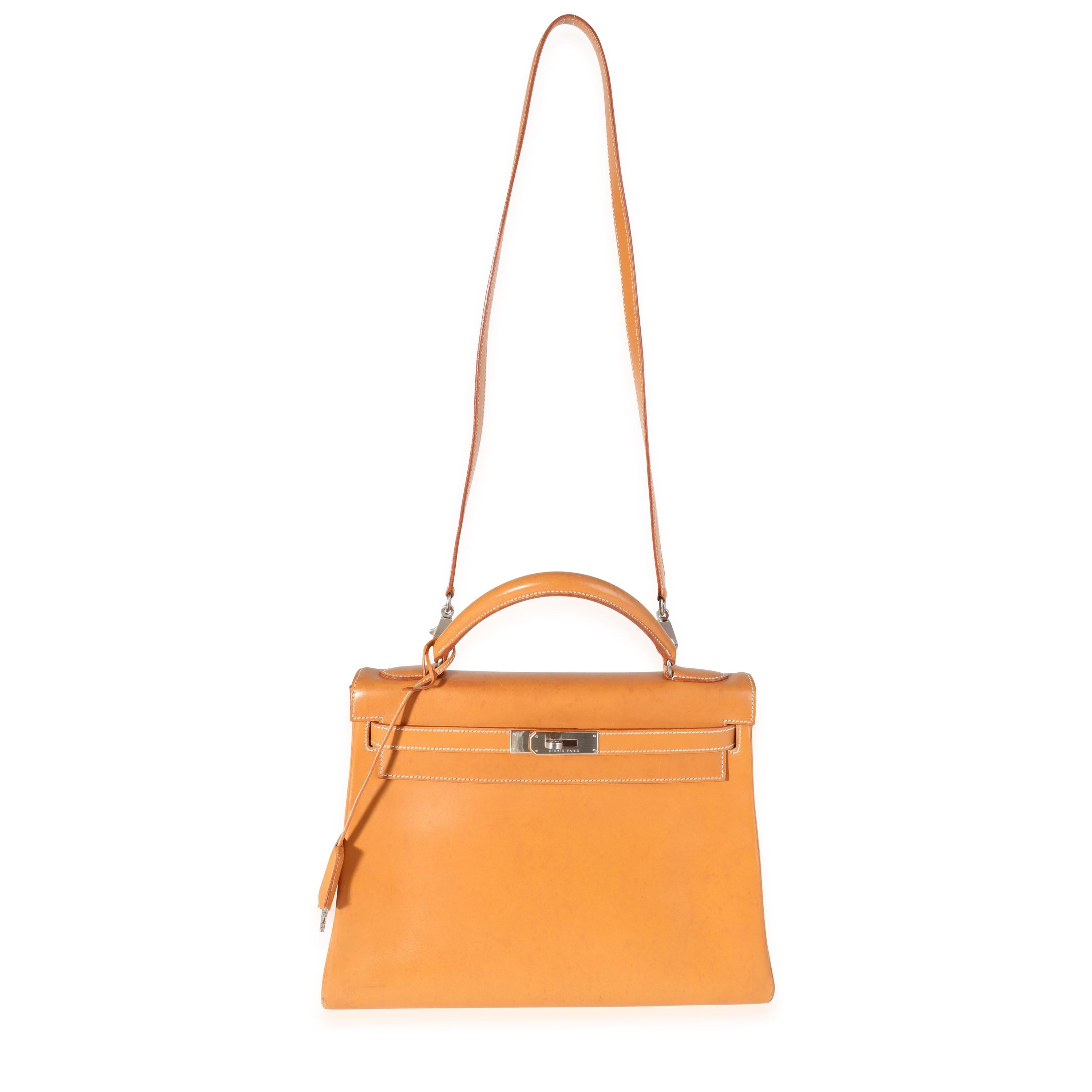 Listing Title: Hermès Natural Vache Retourne Kelly 32 BPHW
SKU: 119423
Condition: Pre-owned (3000)
Handbag Condition: Good
Condition Comments: Good Condition. Plastic on some hardware. Scuffing to corners. Watermarks, discoloration, and scuffing