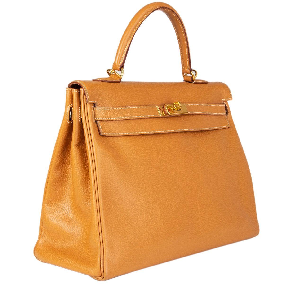 Hermes 'Kelly II 35 Retourner' bag in Naturelle (beige) Vache Ardennes leather with contrasting white stitching. Lined in Chevre (goat skin) with two open pockets against the front and a zipper pocket against the back. Has been carried and with