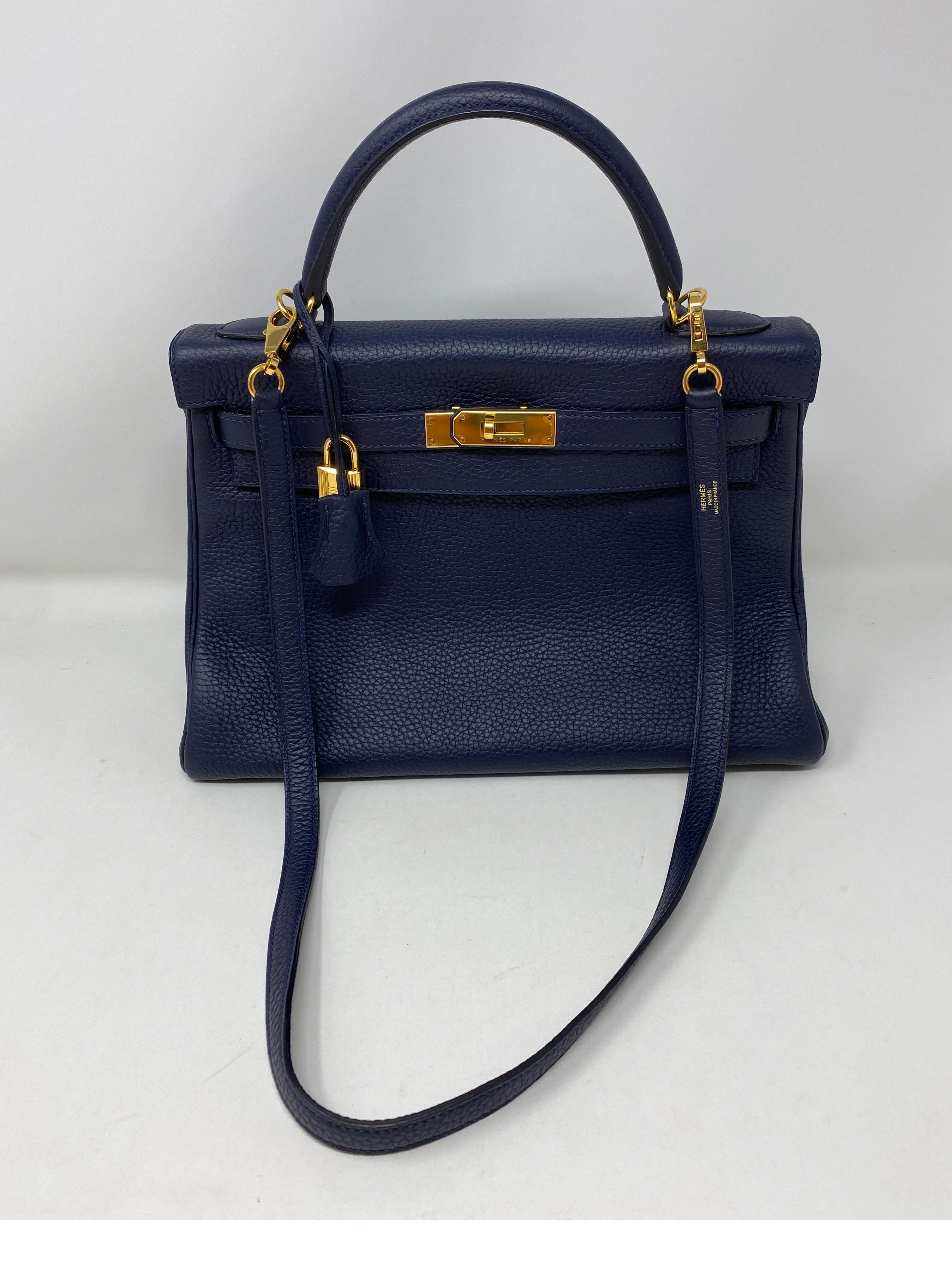 Hermes Navy Kelly 32 Bag. Most wanted smaller size Kelly 32. Gorgeous dark blue color with gold hardware. Clemence leather. Excellent like new condition. Add to your collection. Includes clochette, lock, keys, and dust cover. Guaranteed authentic. 
