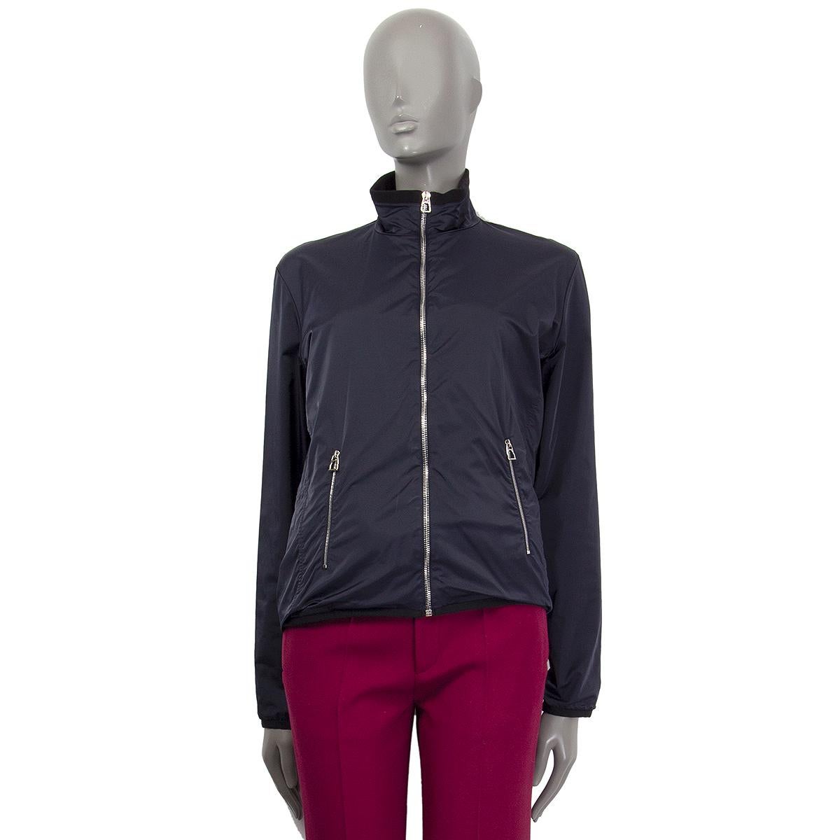 Hermes zip-front windbreaker in midnight blue polyamide (with 8% elastane). Has wo zip pockets and grosgrain trim. Lined in black fleece (polyester with 8% elastane). Has been worn and is in excellent condition.

Tag Size XL
Size XL
Shoulder 44cm
