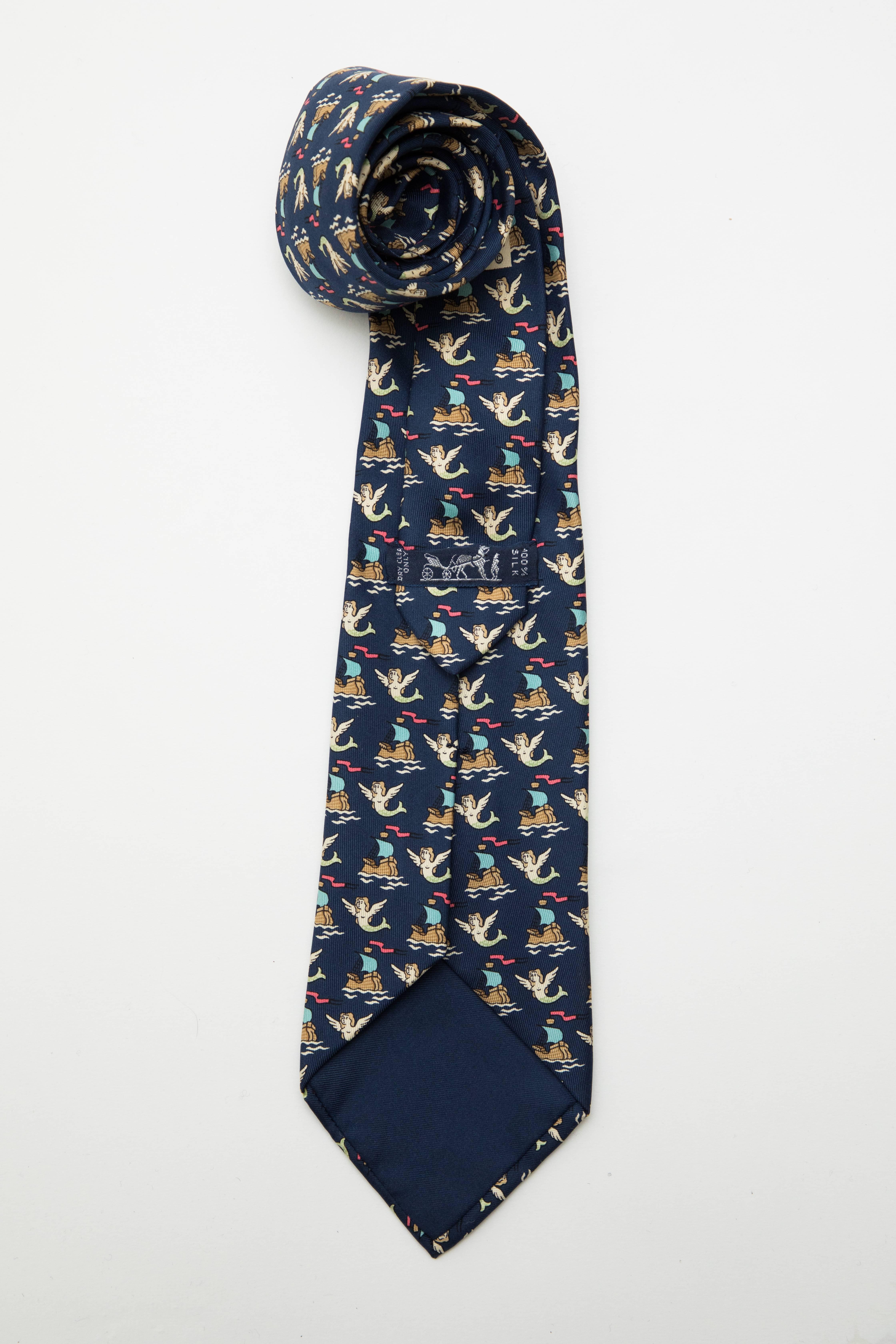 Hermes, Circa 1990's navy blue silk tie.

Length: 58, Width 3.5
