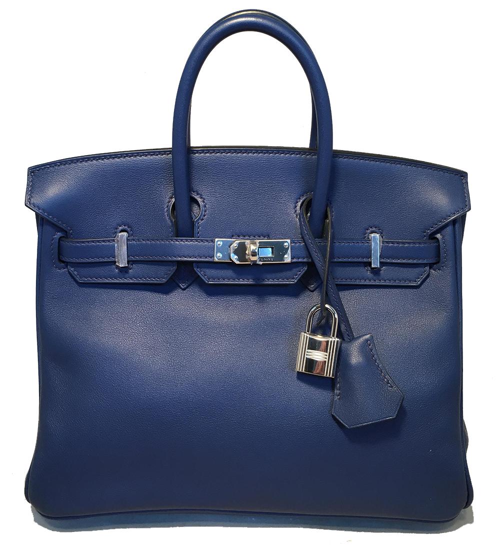 Hermes Navy Blue Swift Leather 25cm Birkin Bag PHW in like new condition. Navy blue swift leather trimmed with silver palladium hardware that still has the protective plastic covering over it. Signature twisting strap and flap closure opens to a