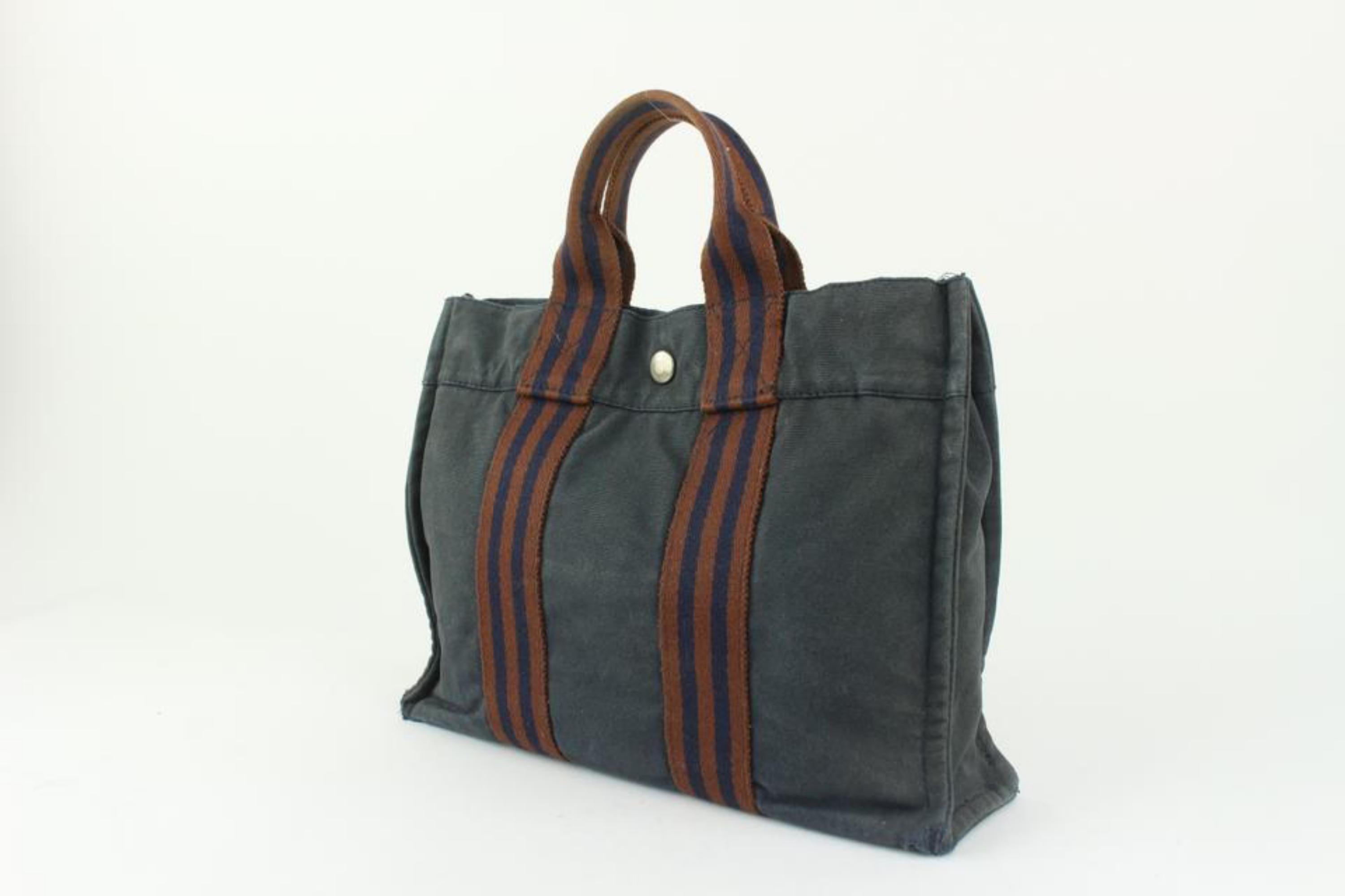 Hermès Navy Striped Fourre Tout PM Tote Bag 1216h2
Made In: France
Measurements: Length:  11.5