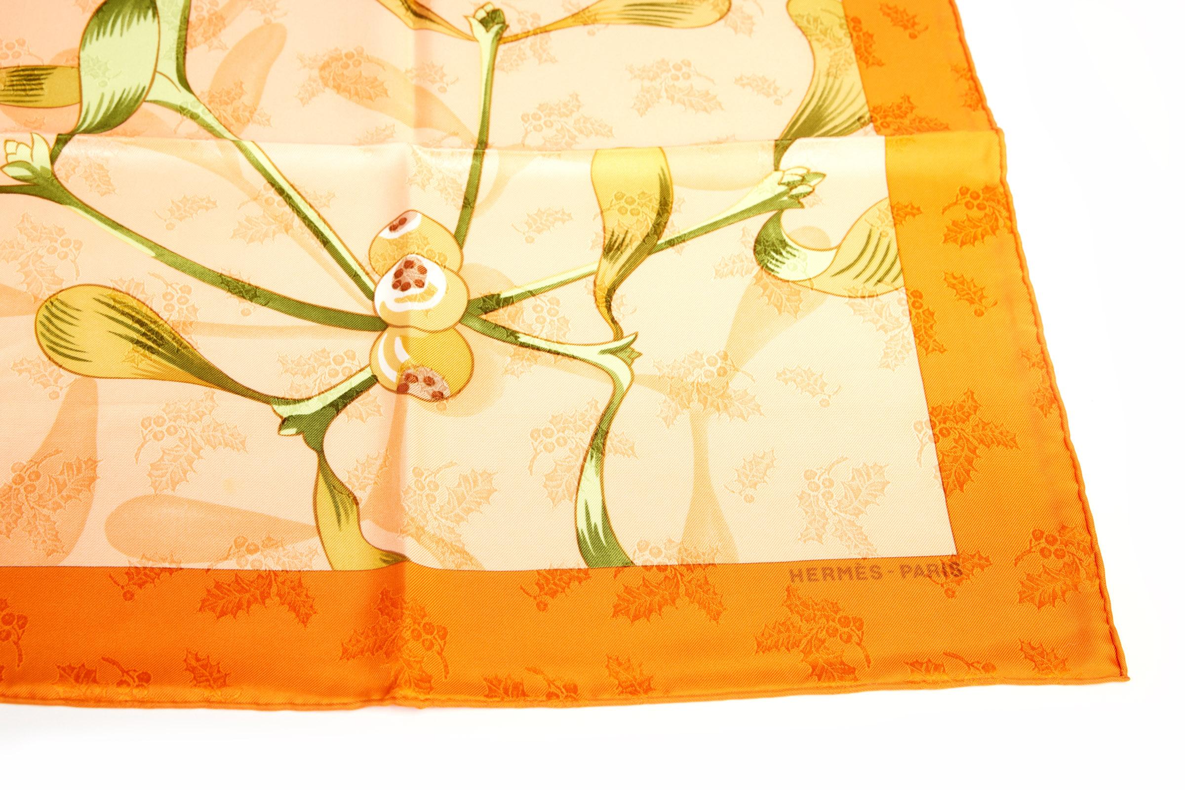 Hermès orange silk Neige d'Antan scarf. Hand-rolled edges.