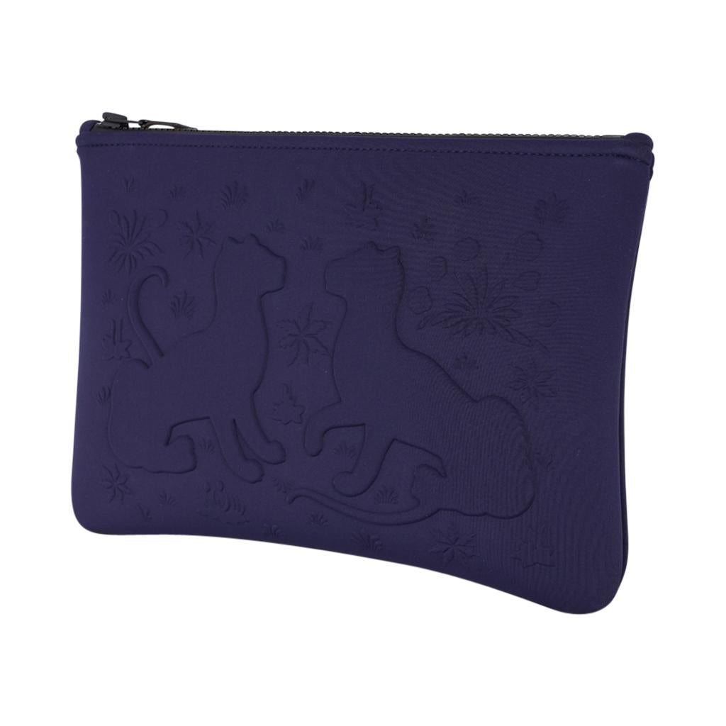 Mightychic offers a limited edition Hermes Neobain Les Leopards case featured in the medium model.
Rich, deep Marine with two leopards embossed on front.
Top black zipper with Barenia leather zipper toggle.
Water repellent Polyamide and elastane