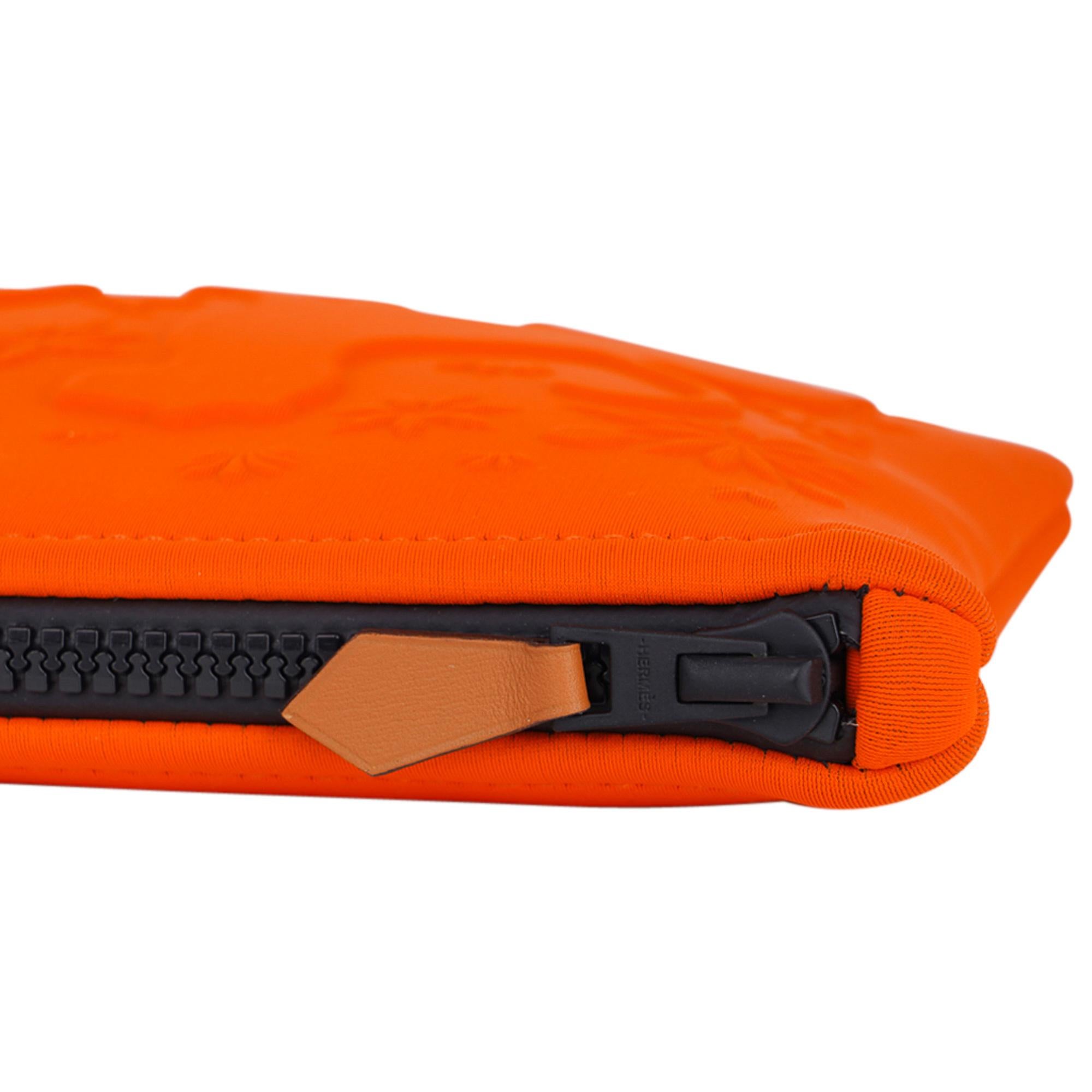 Guaranteed authentic limited edition Hermes Neobain Les Leopards case featured in the small model.
Beautiful signature Orange with two leopards embossed on front.
Top black zipper with Barenia leather zipper toggle.
Water repellent Polyamide and